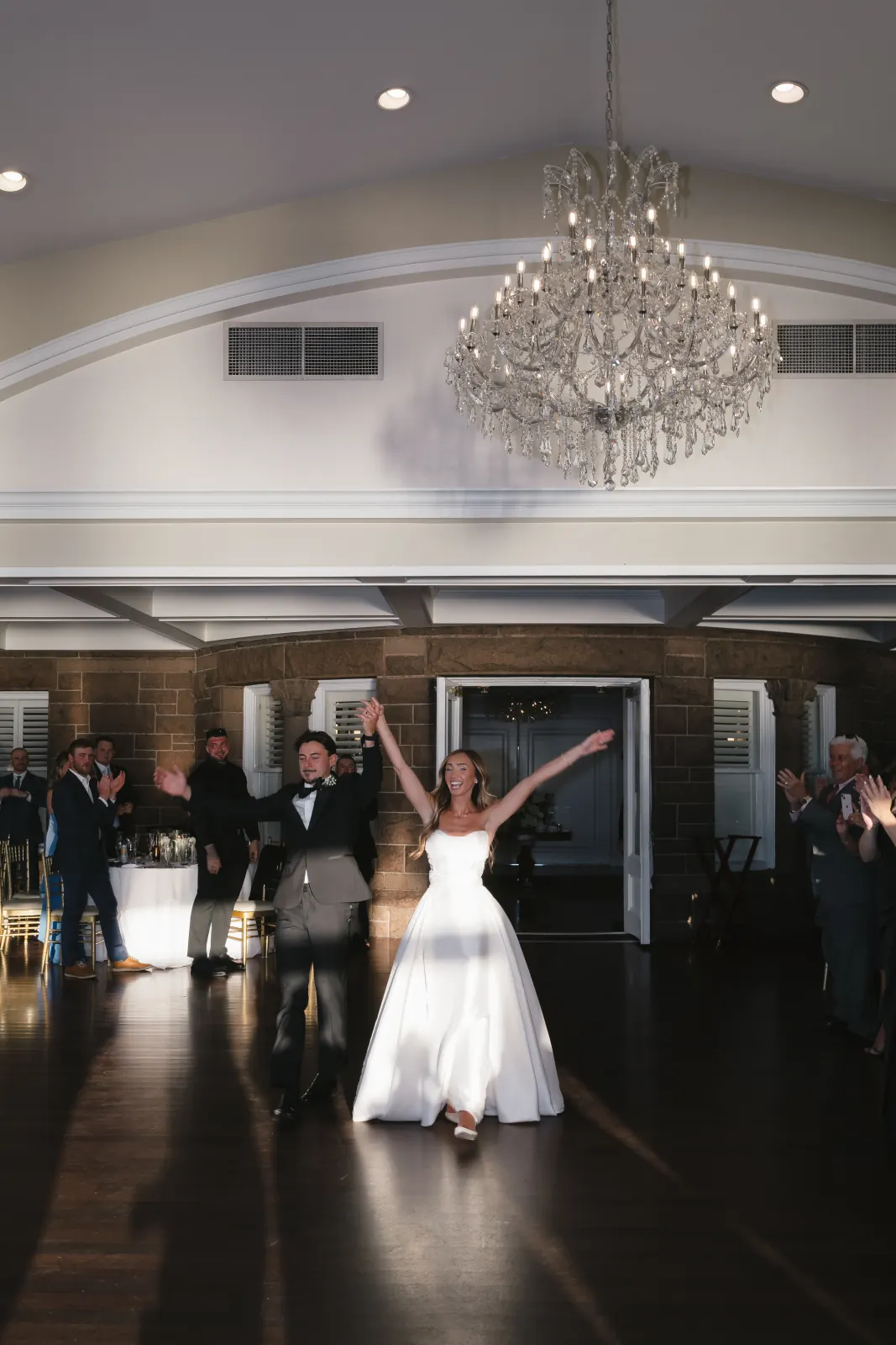 Bride and groom's grand entrance into the OceanCliff ballroom
