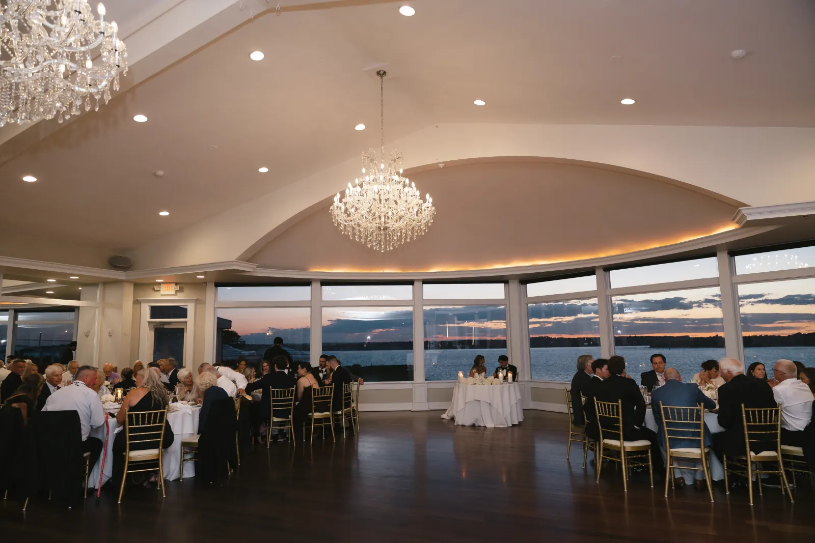 The OceanCliff ballroom at sunset — chandeliers and Narragansett Bay views