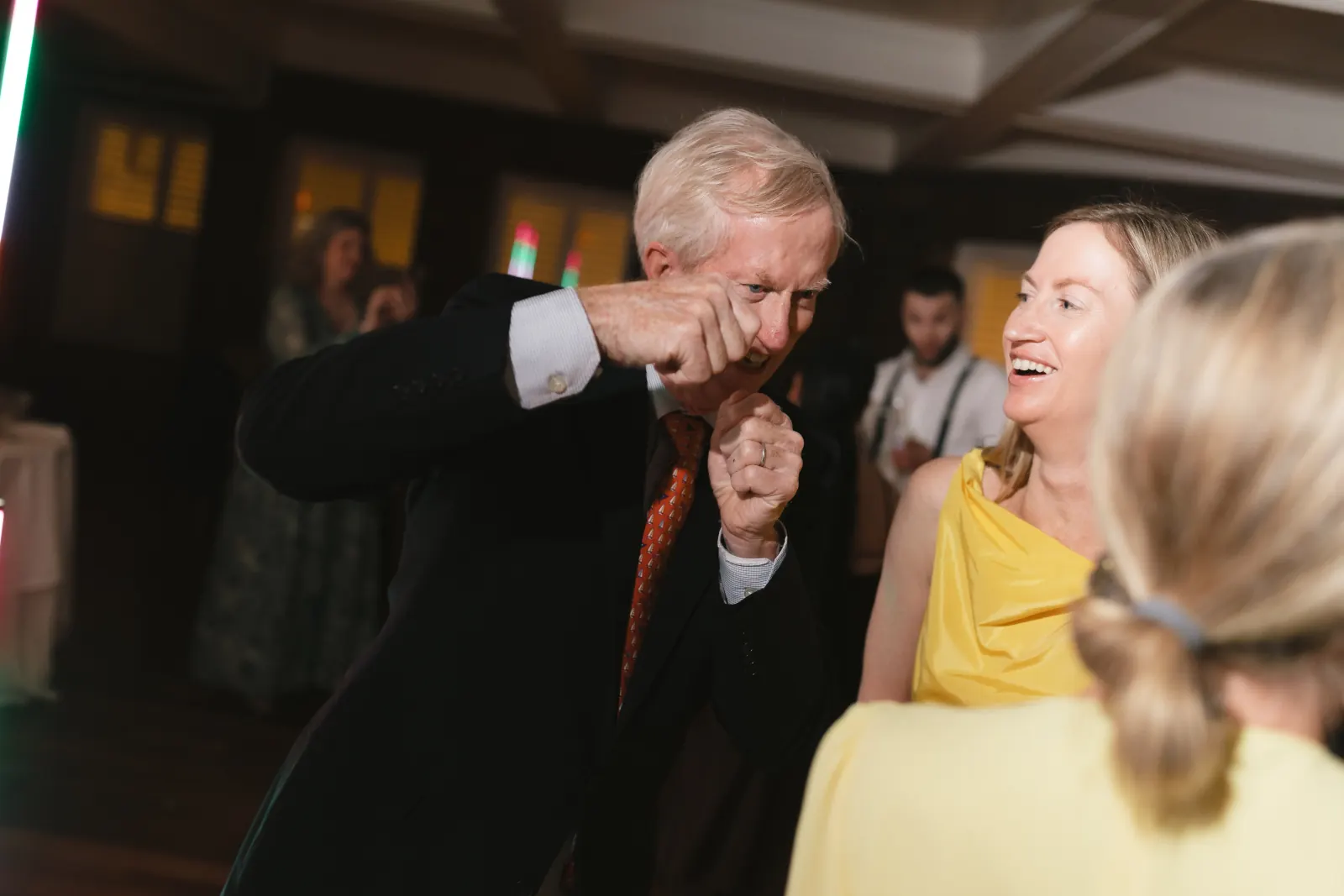 Guests share a joyful dance at the Newport wedding reception