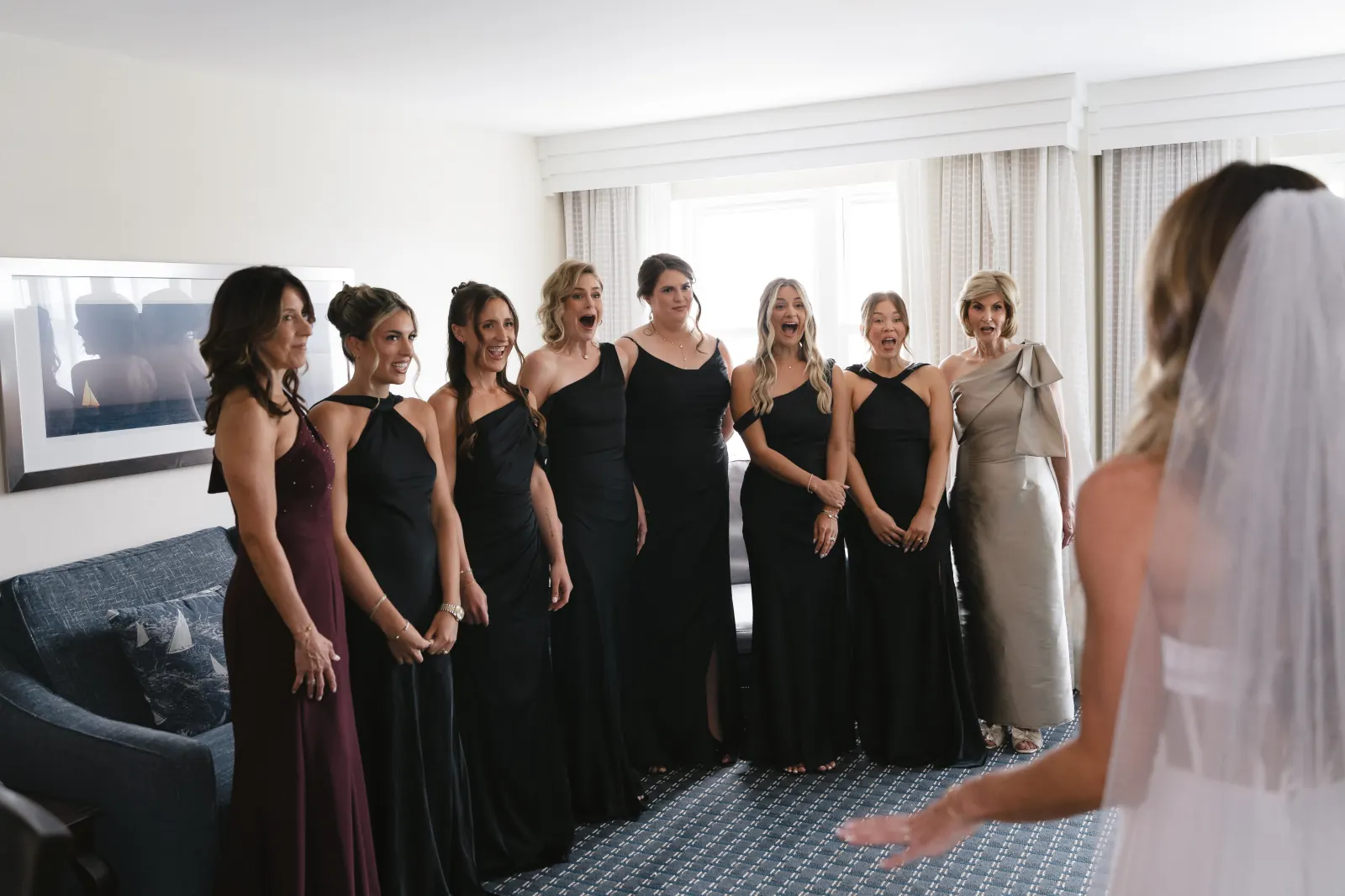 The bridal party's first reaction to seeing the bride in her dress