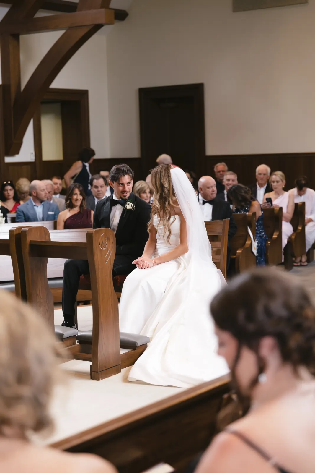 Bride and groom at the altar during their Catholic ceremony in Newport
