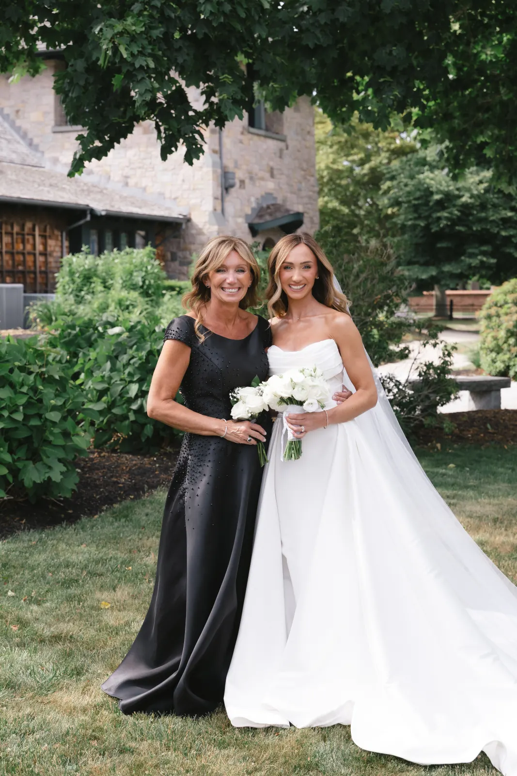 Bride with her mother outside the OceanCliff mansion in Newport