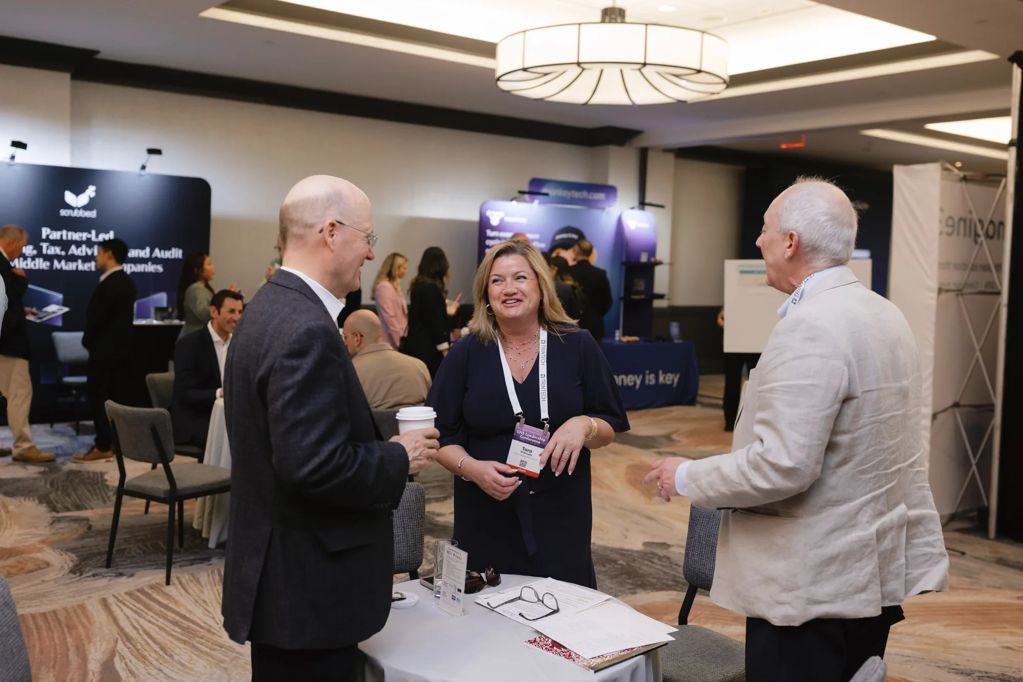 Finance leaders networking in the exhibit hall at the CFO Leadership Conference, Sheraton Boston