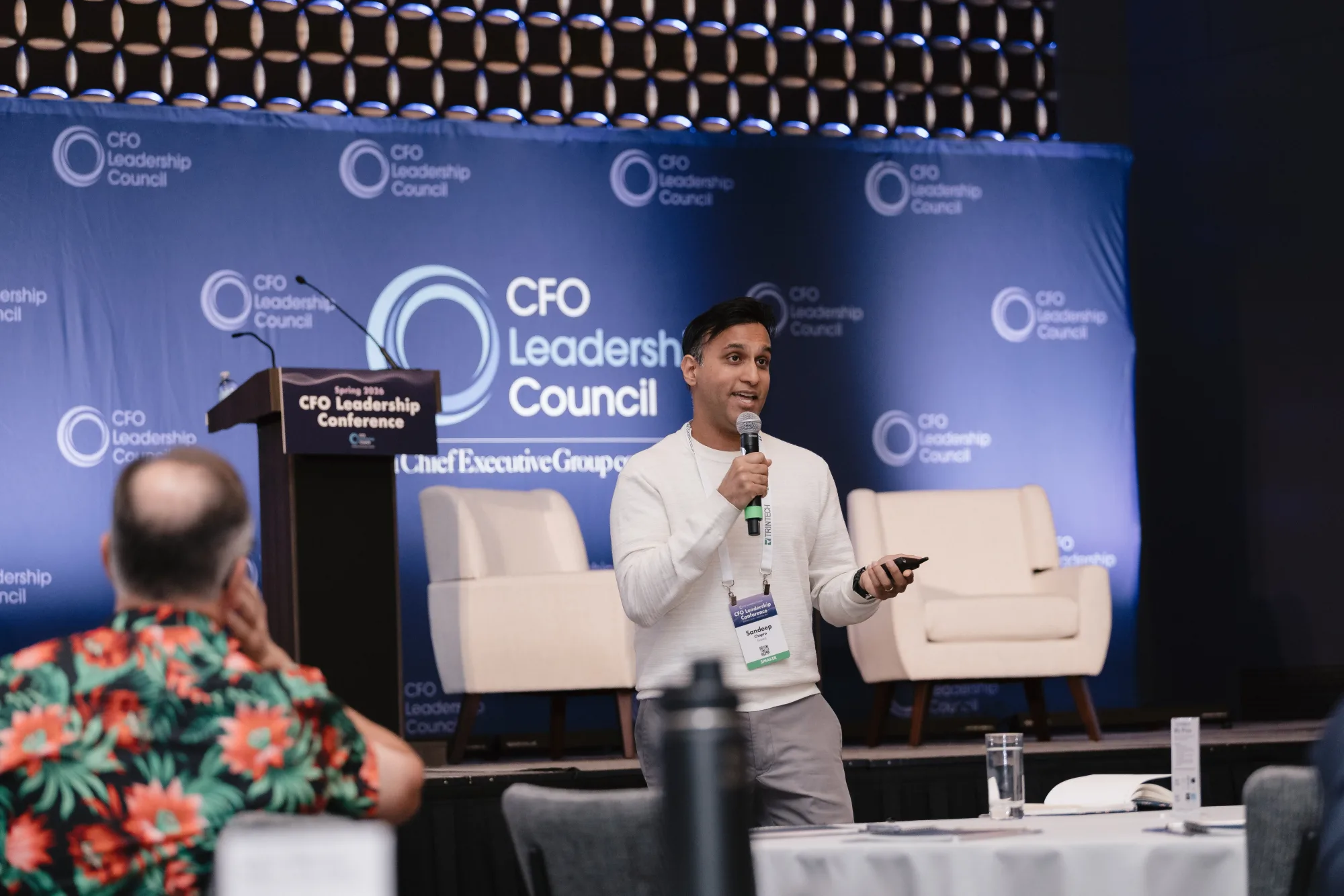 Speaker presenting in front of the CFO Leadership Council backdrop at the Spring 2026 CFO Leadership Conference, Sheraton Boston
