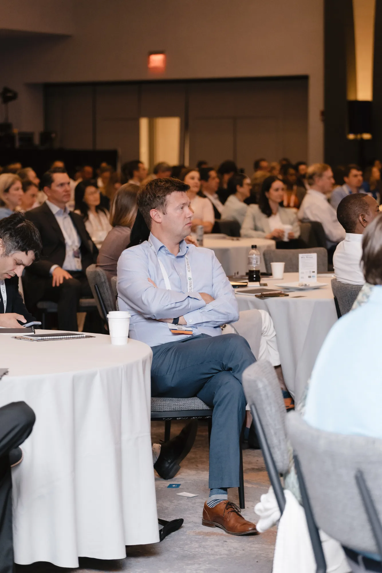 Engaged attendee listening during a general session at the CFO Leadership Conference, Boston Massachusetts
