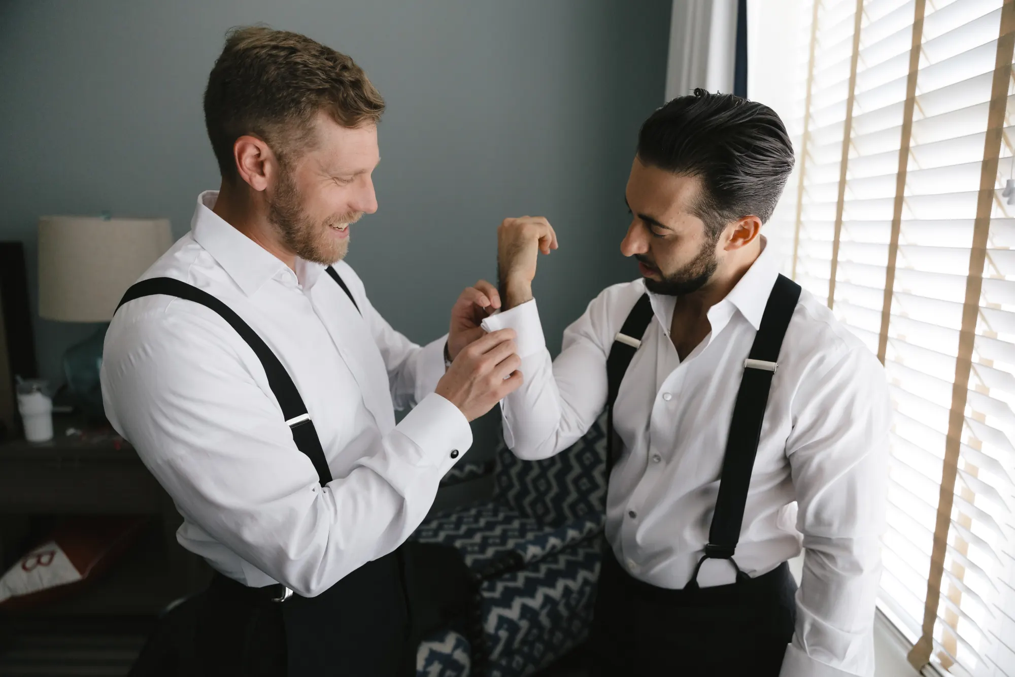 Groomsmen help each other with cufflinks before the Gloucester wedding