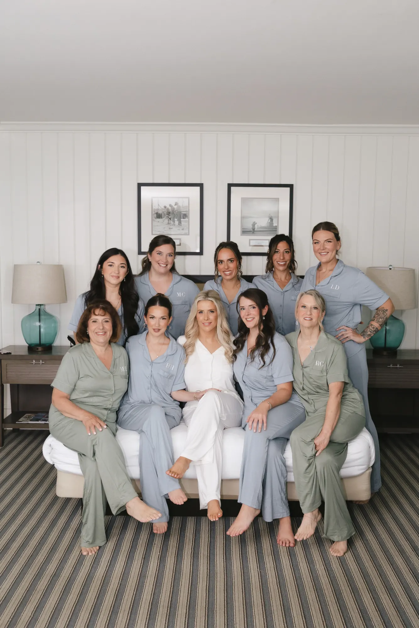 Bridesmaids in matching blue sets gathered on the couch at the Beauport Hotel