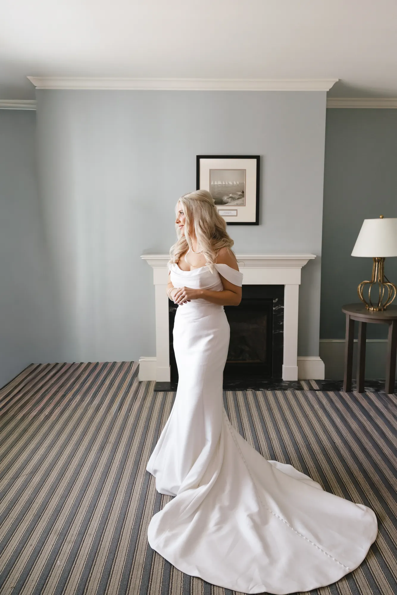 Full-length portrait of the bride and her train in the Beauport Hotel suite