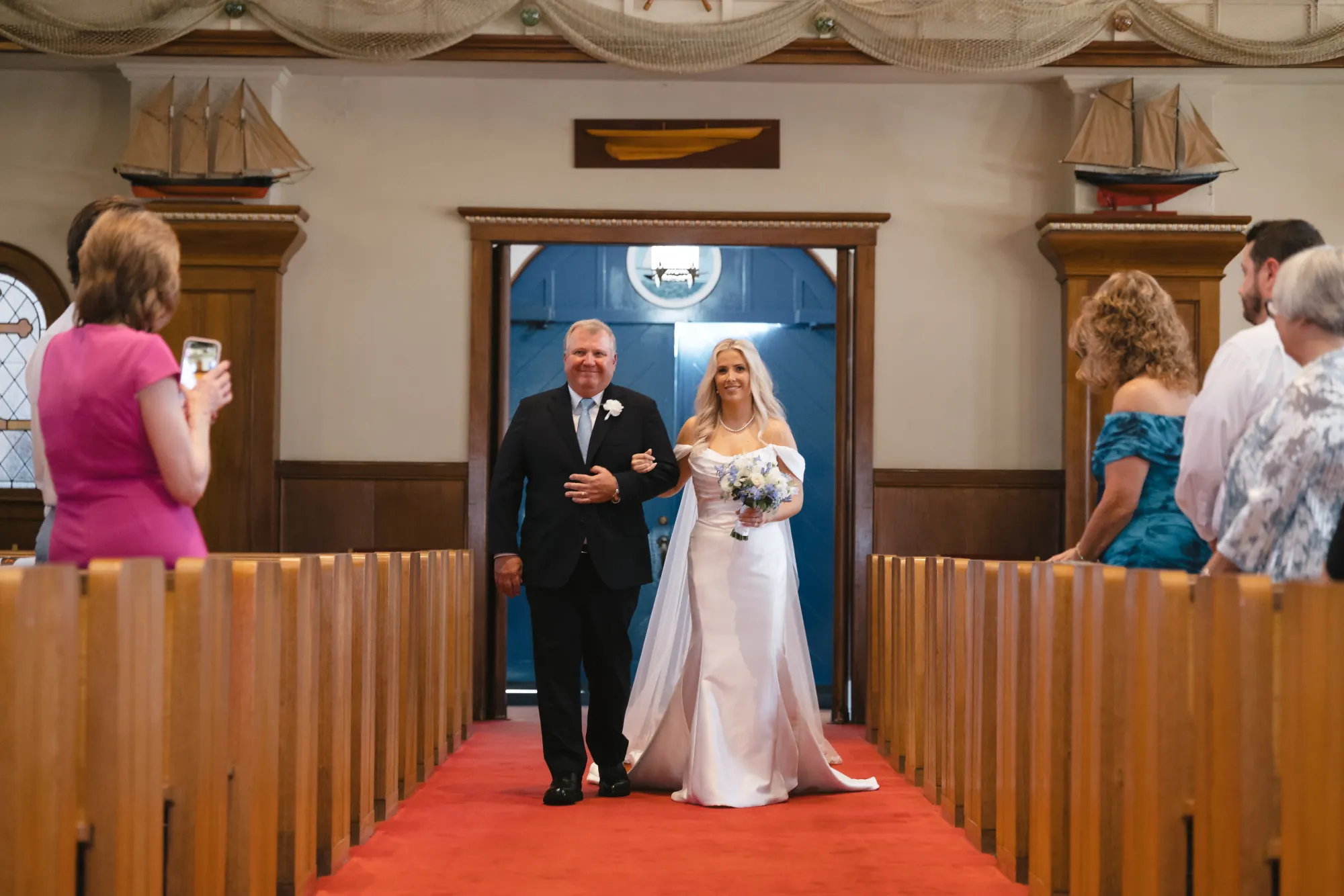 Bride and her father enter Our Lady of Good Voyage in Gloucester, Massachusetts