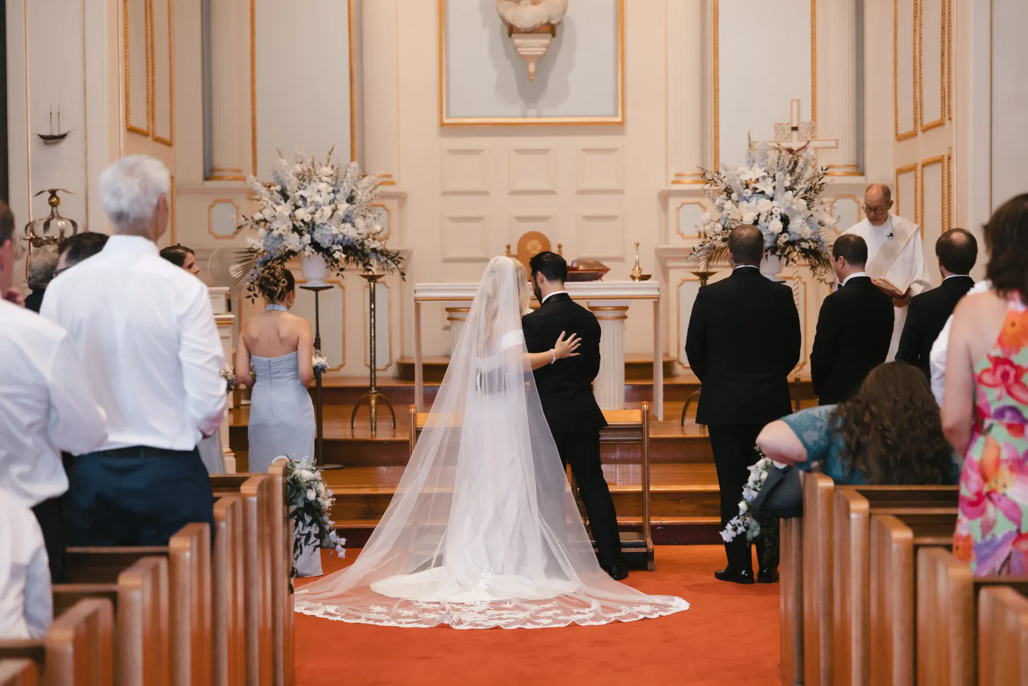 Guests look on as the newlyweds are announced in the church