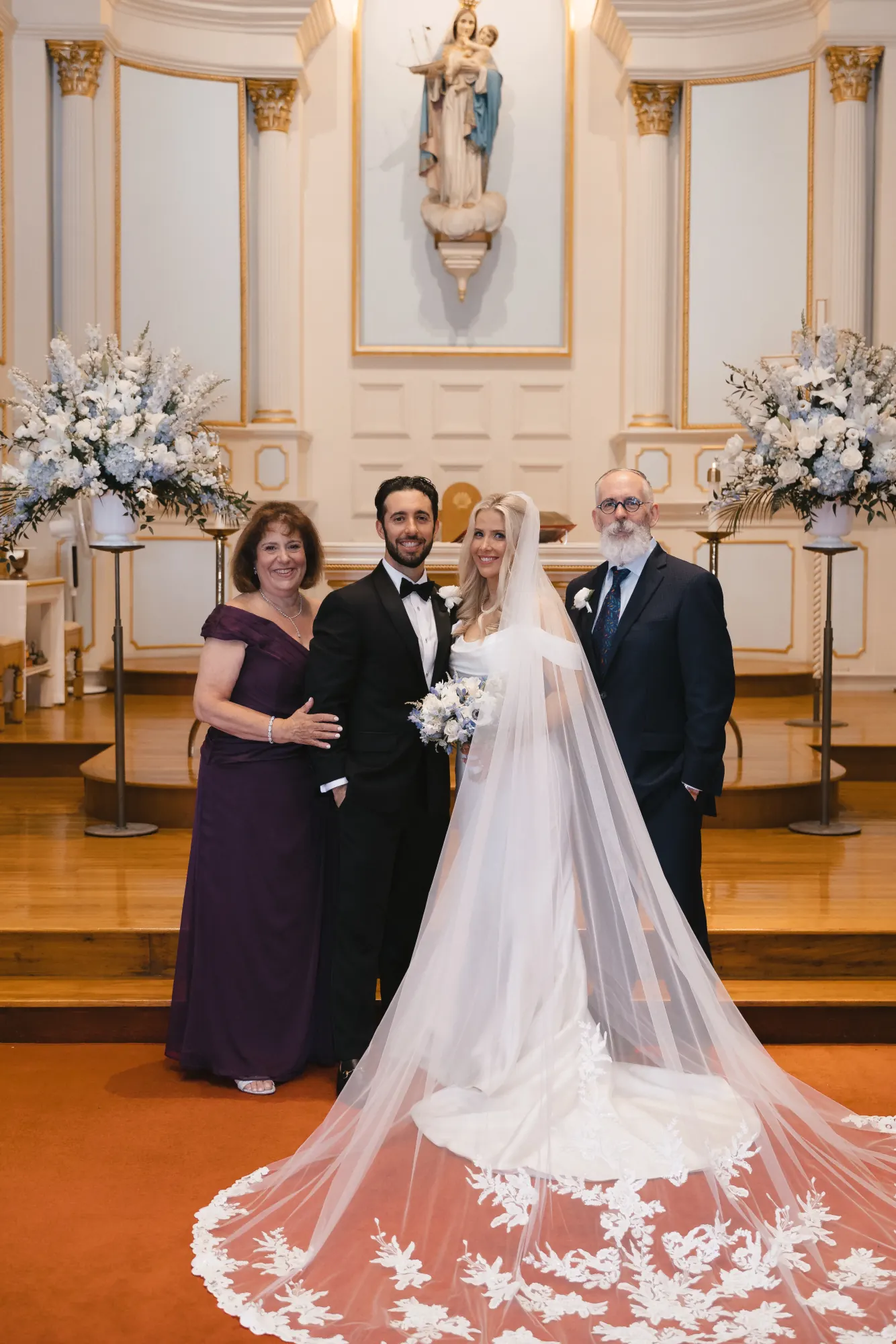 Family formal portrait at the altar of the Gloucester church