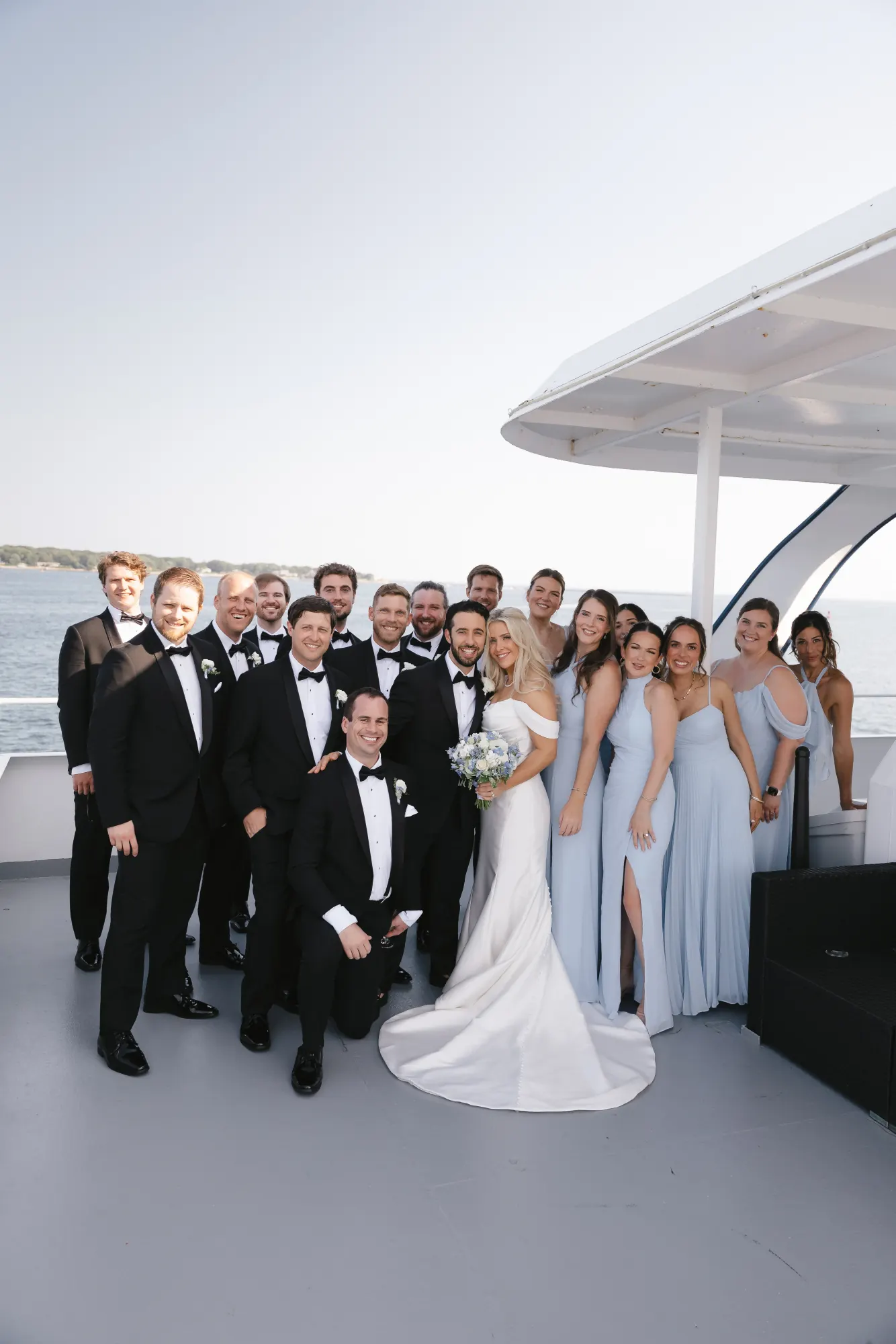 Wedding party portrait on the upper deck of the harbor cruise