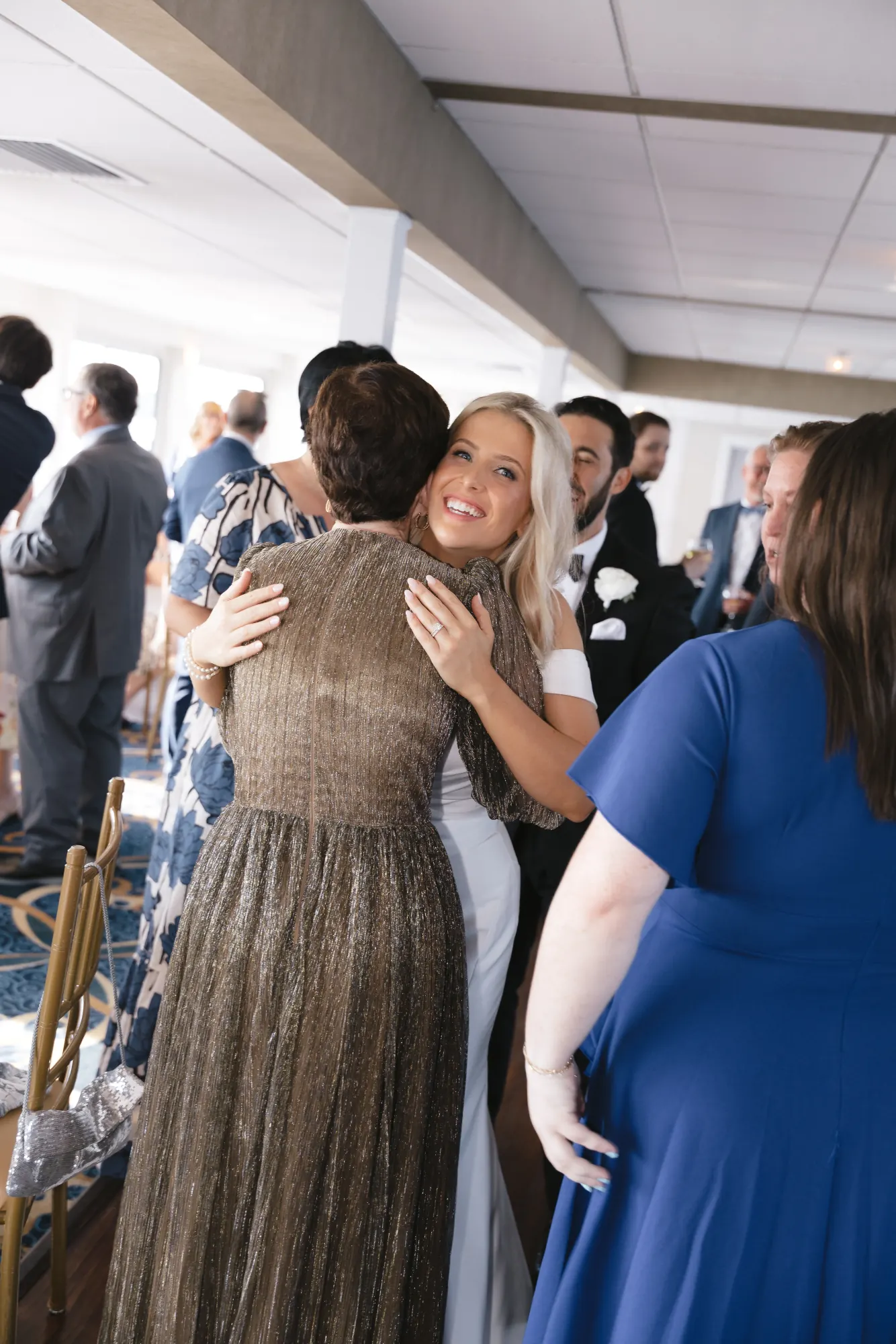 Bride greets guests aboard the cocktail hour cruise