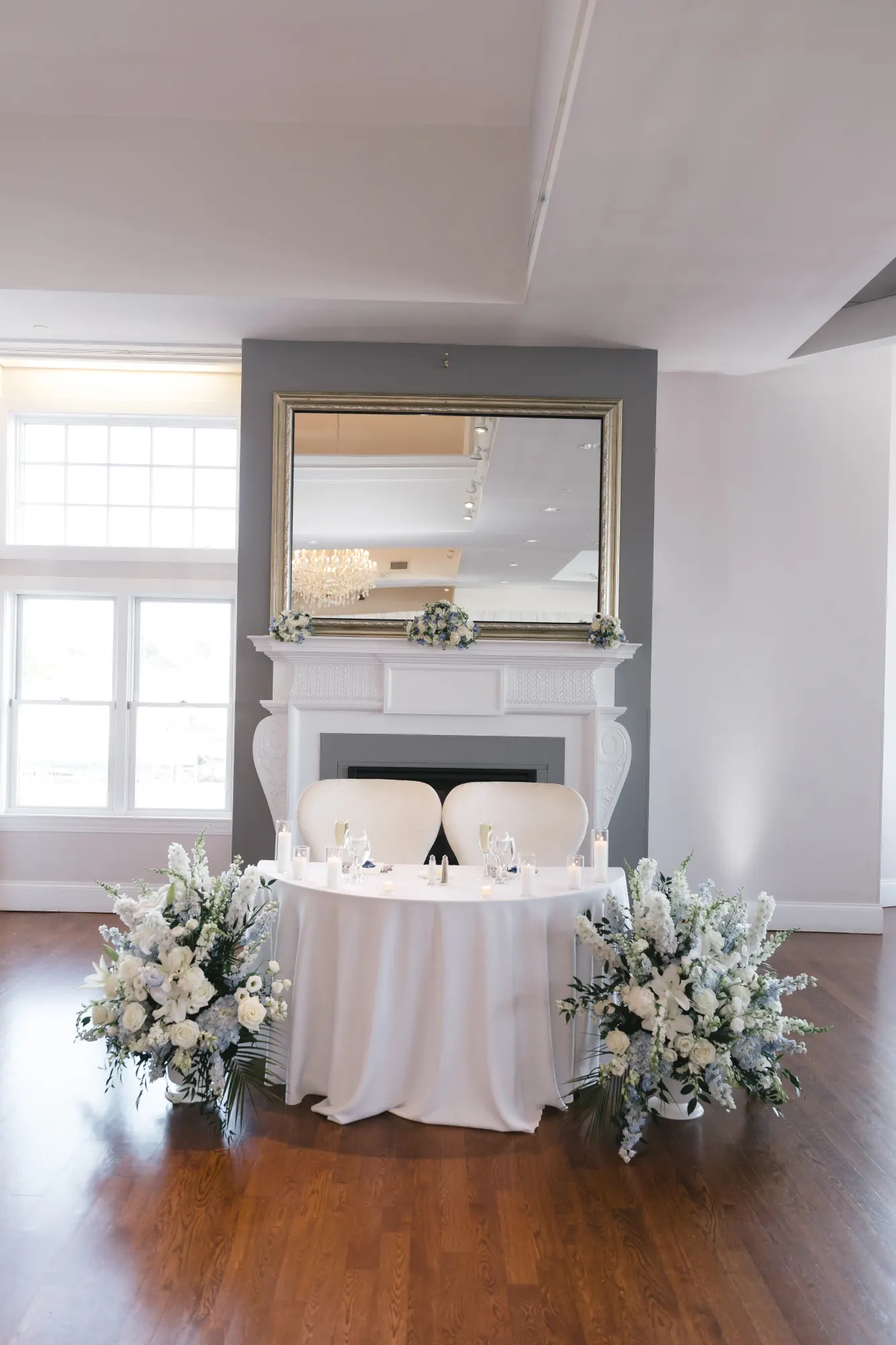 Sweetheart table with white florals in the Cruiseport Gloucester ballroom