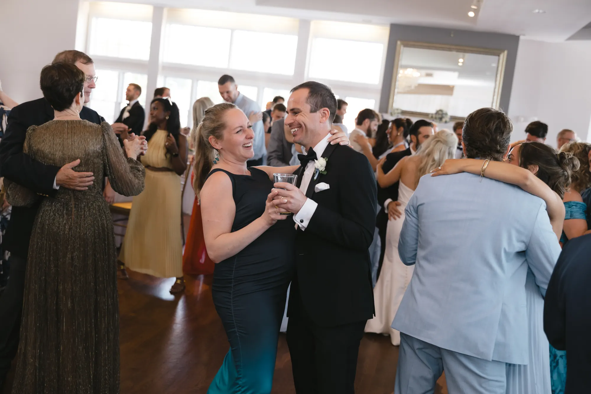 Guests slow dance at the Cruiseport Gloucester wedding reception