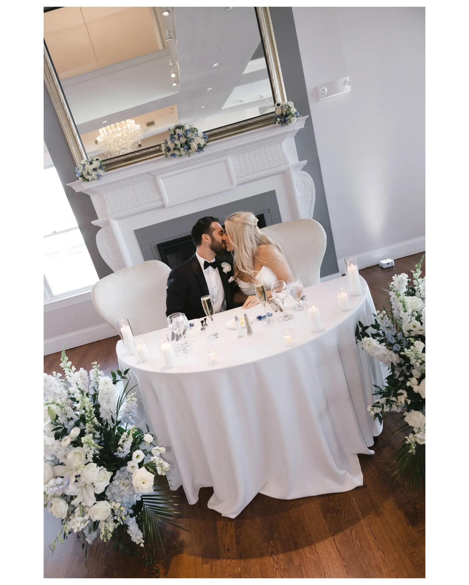 The newlyweds share a kiss at the sweetheart table