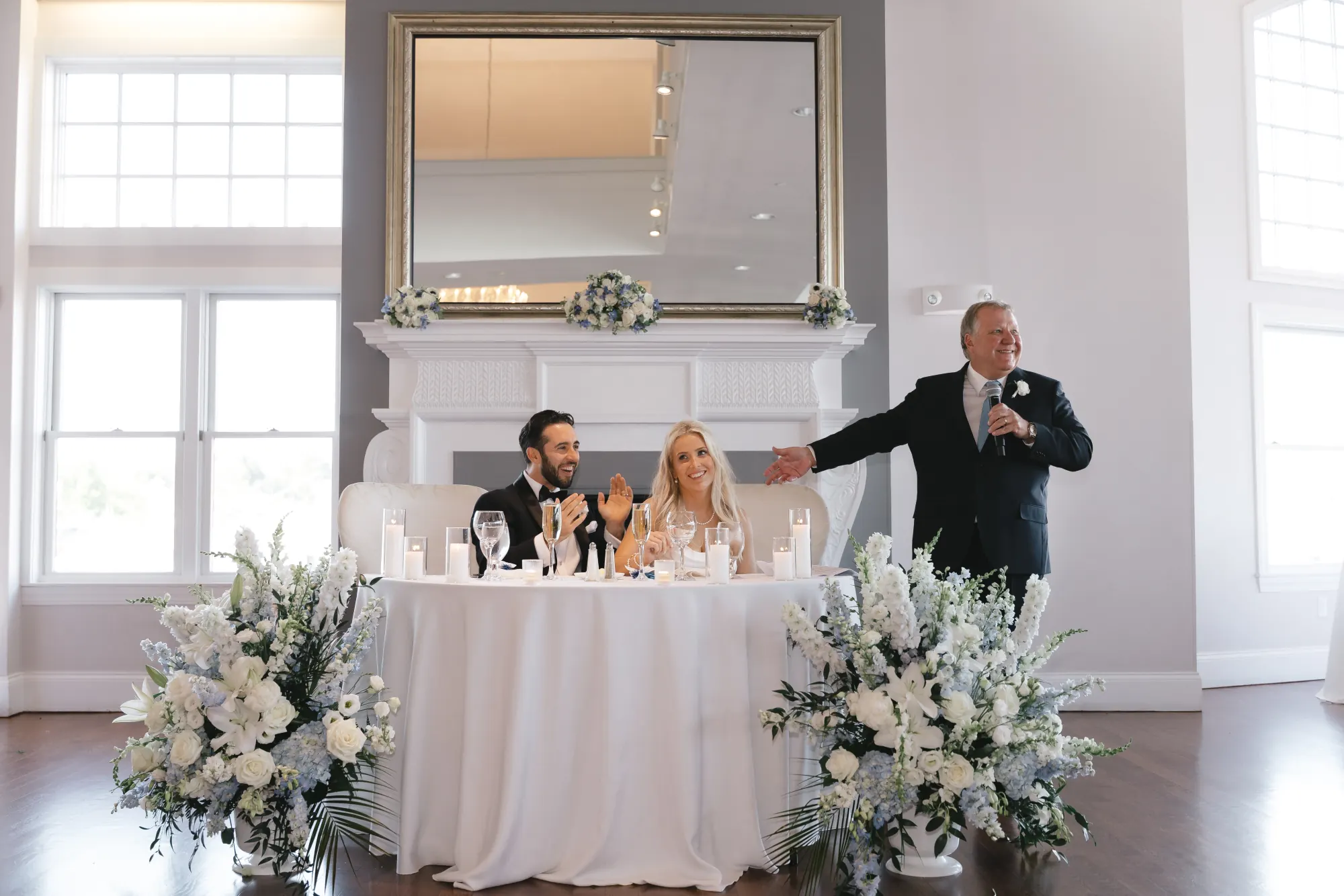 A toast is raised to the couple at the sweetheart table