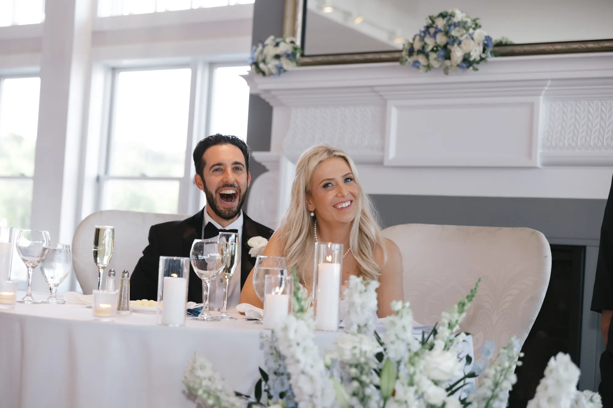 Chris and Abby laugh during the toasts at Cruiseport Gloucester