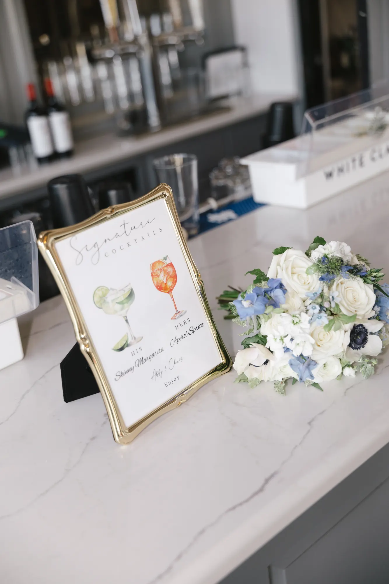 Signature cocktail sign and bouquet at the Cruiseport Gloucester bar