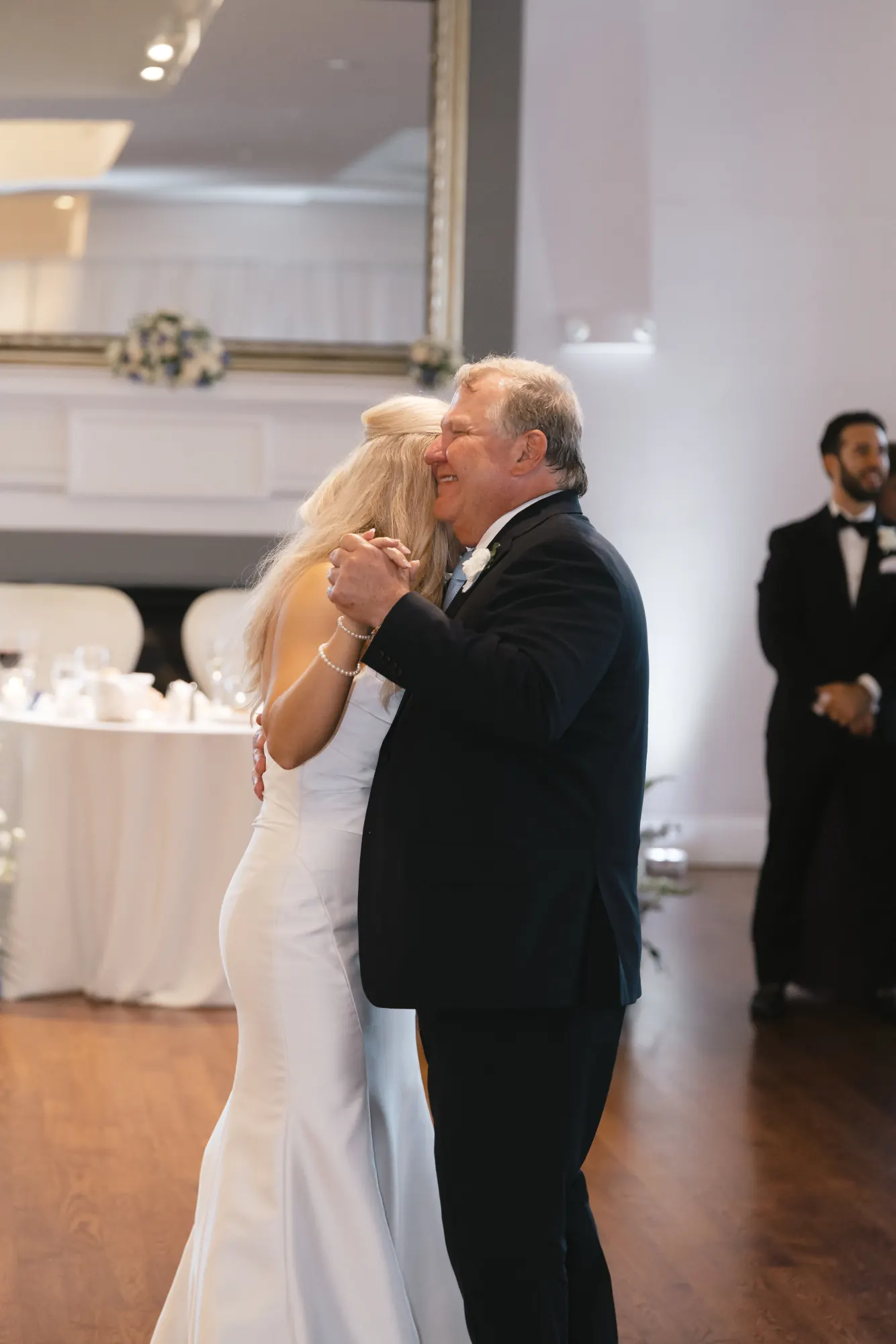 The bride dances with her father in the Cruiseport ballroom