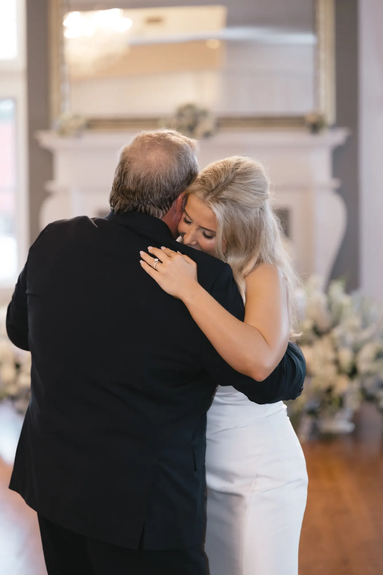 Bride and her father embrace during the father-daughter dance