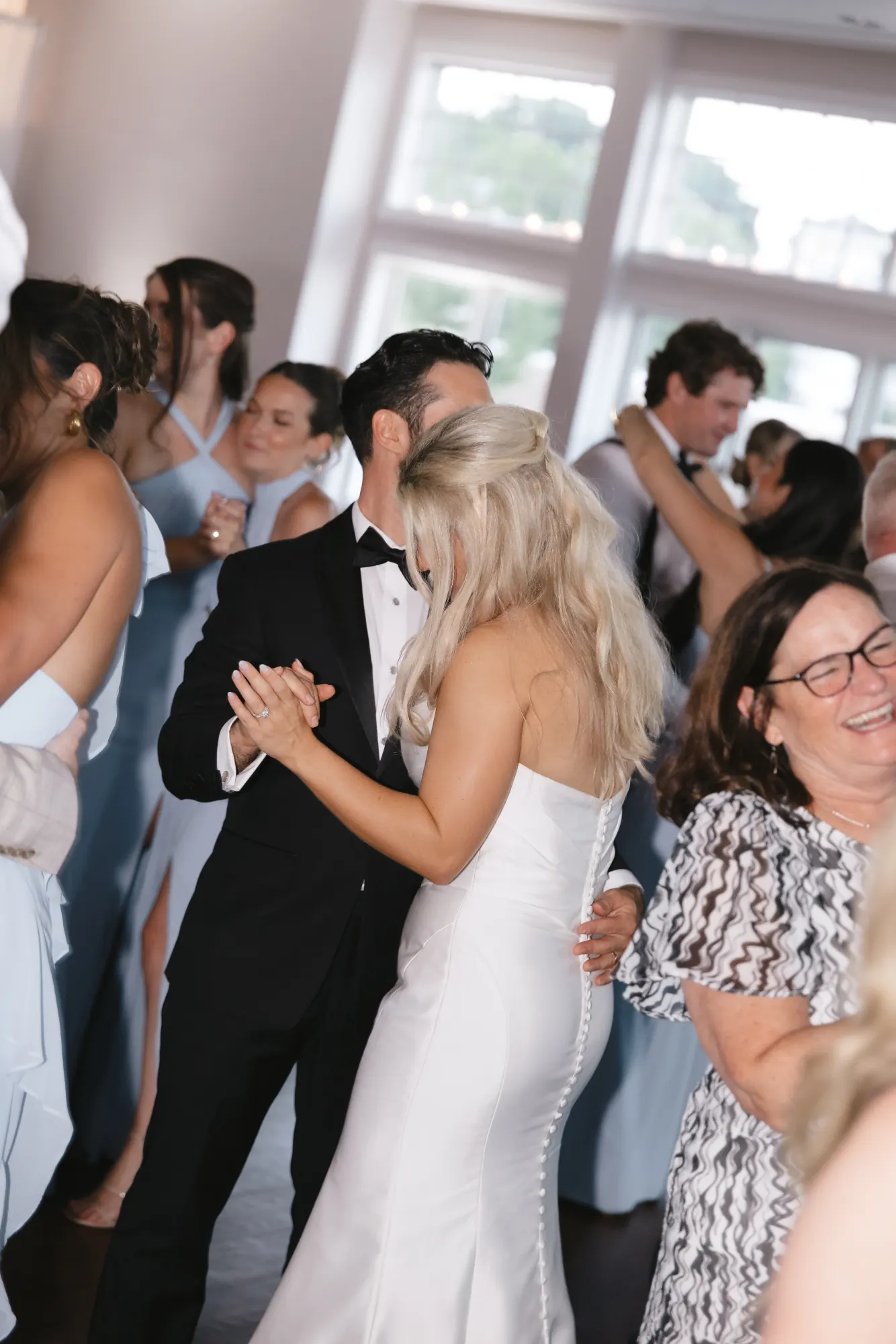 Bride dances with guests at the Gloucester reception