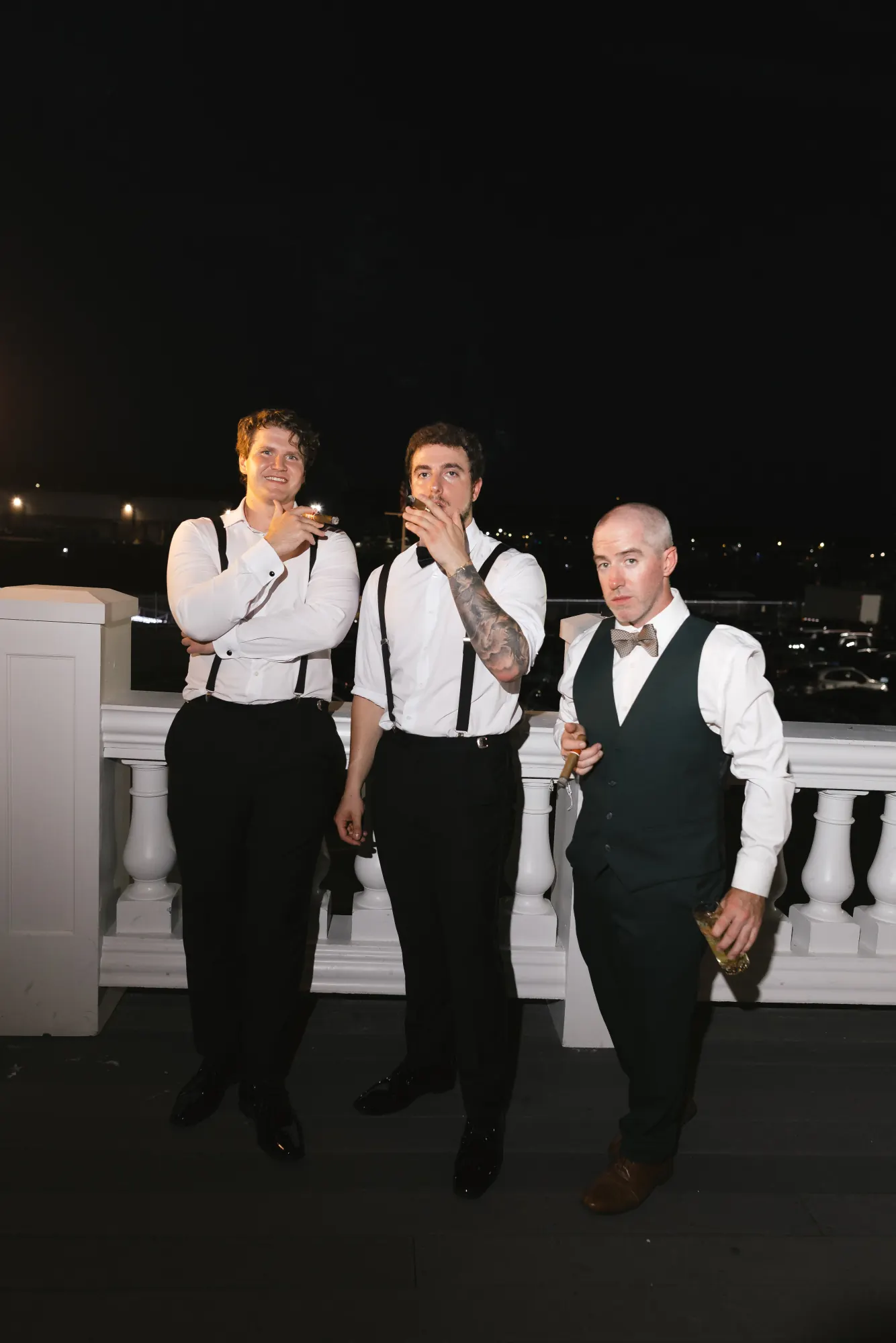 Guests take in the night air on the Cruiseport balcony