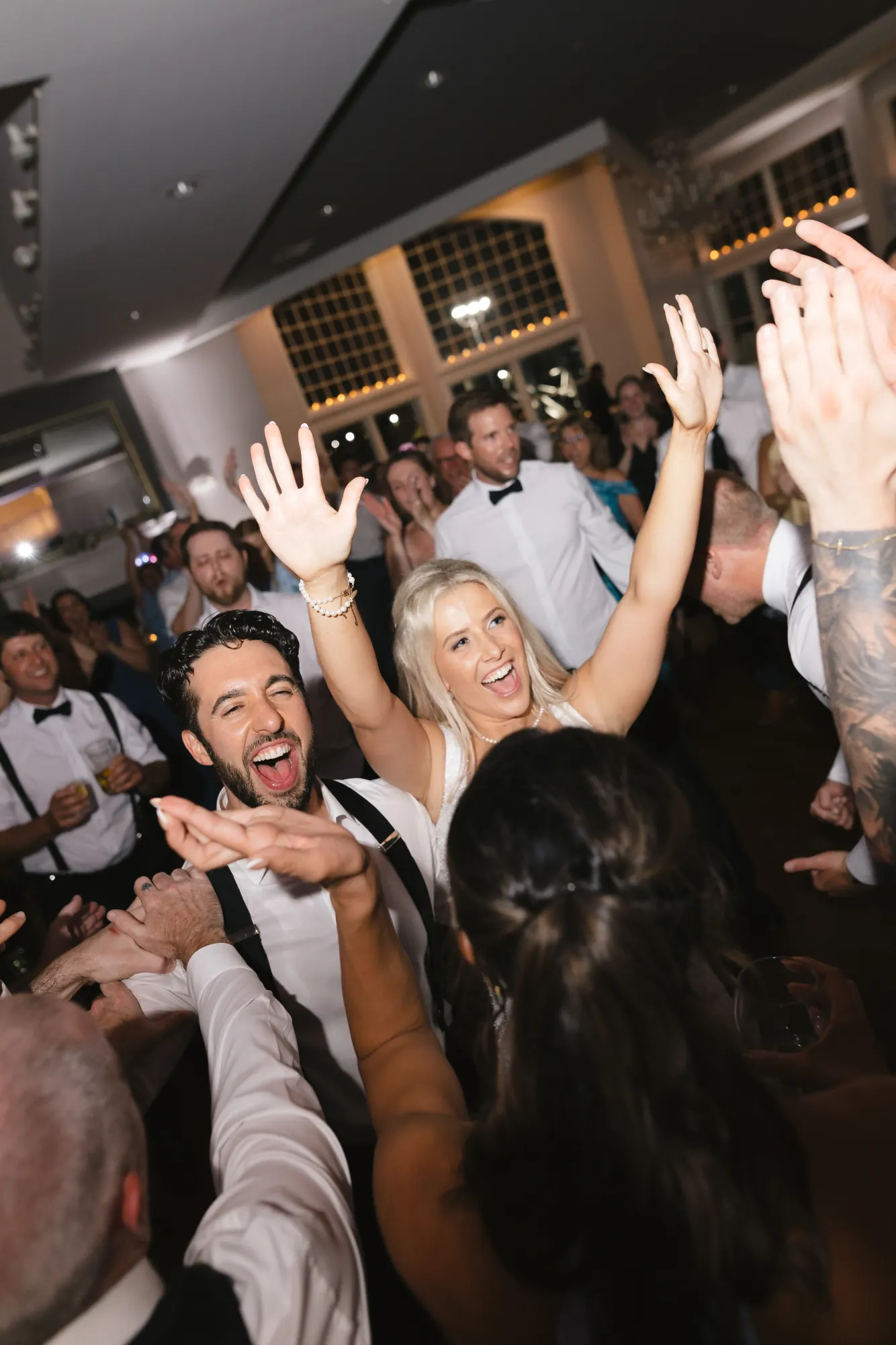 The bride celebrates with guests as the night winds up