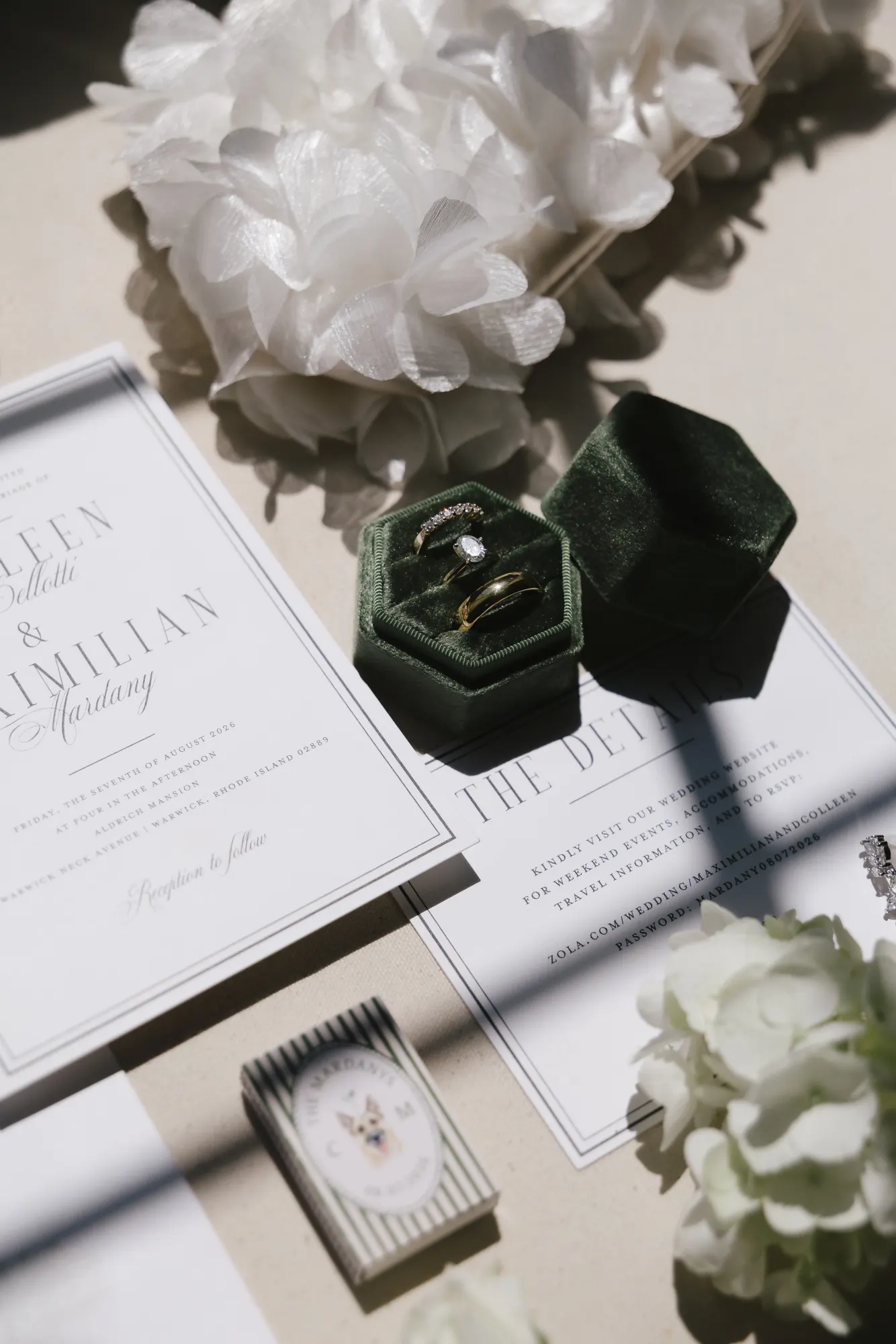 Wedding invitation with the engagement ring in an olive velvet box