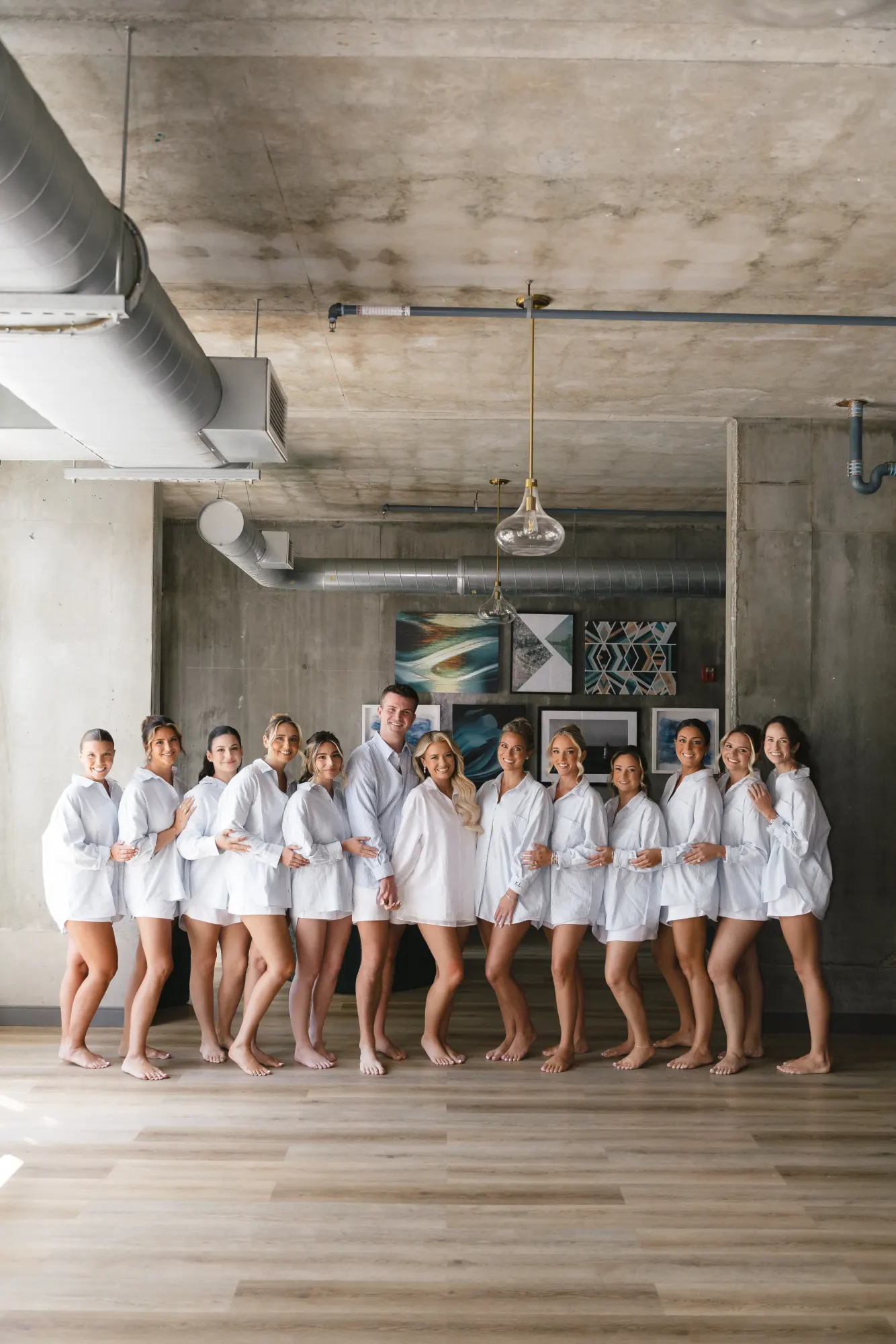 Colleen and her bridesmaids in matching white shirts on the wedding morning