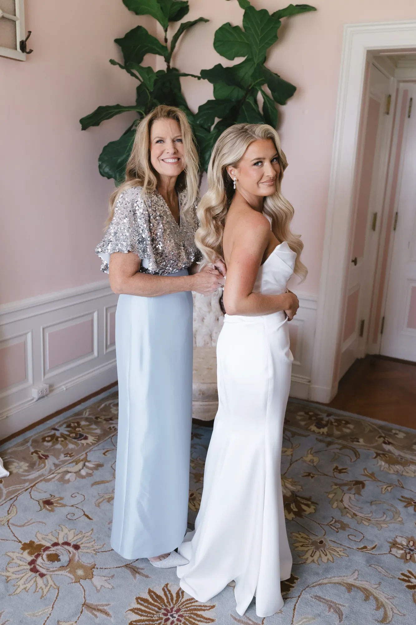 Colleen and her mother in the bridal suite after she steps into her gown
