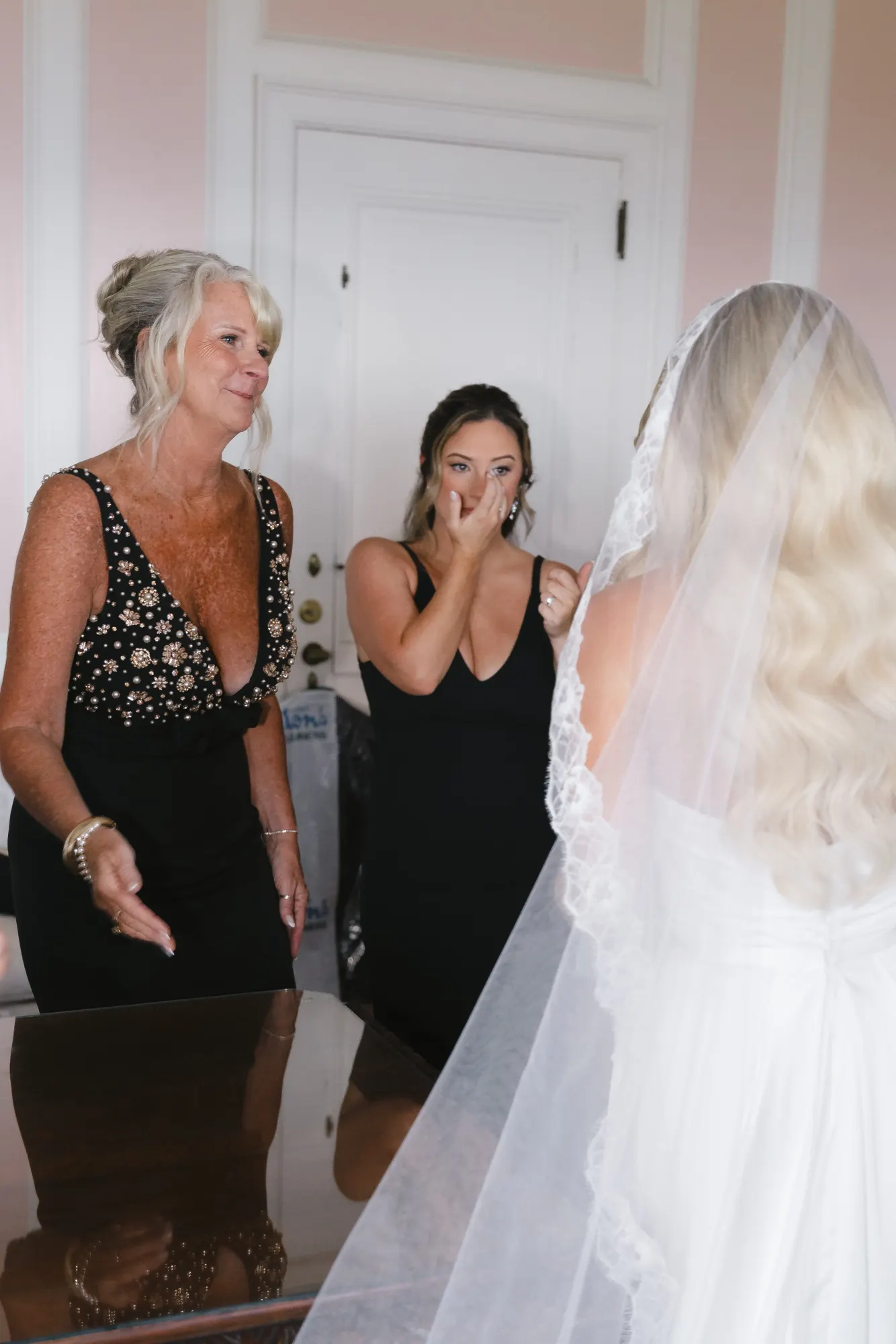 Happy tears during the bridesmaids' first look in the bridal suite