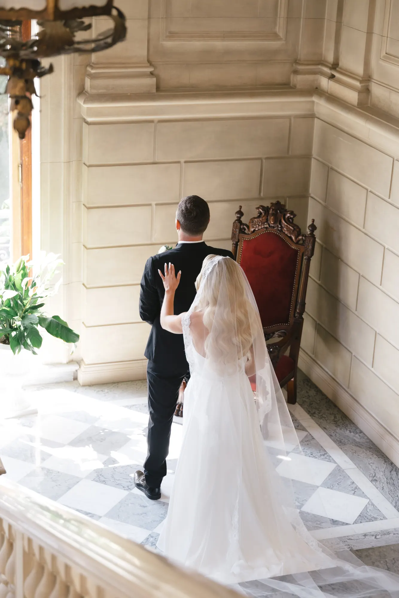 Max turns for the first look on the Aldrich Mansion grand staircase