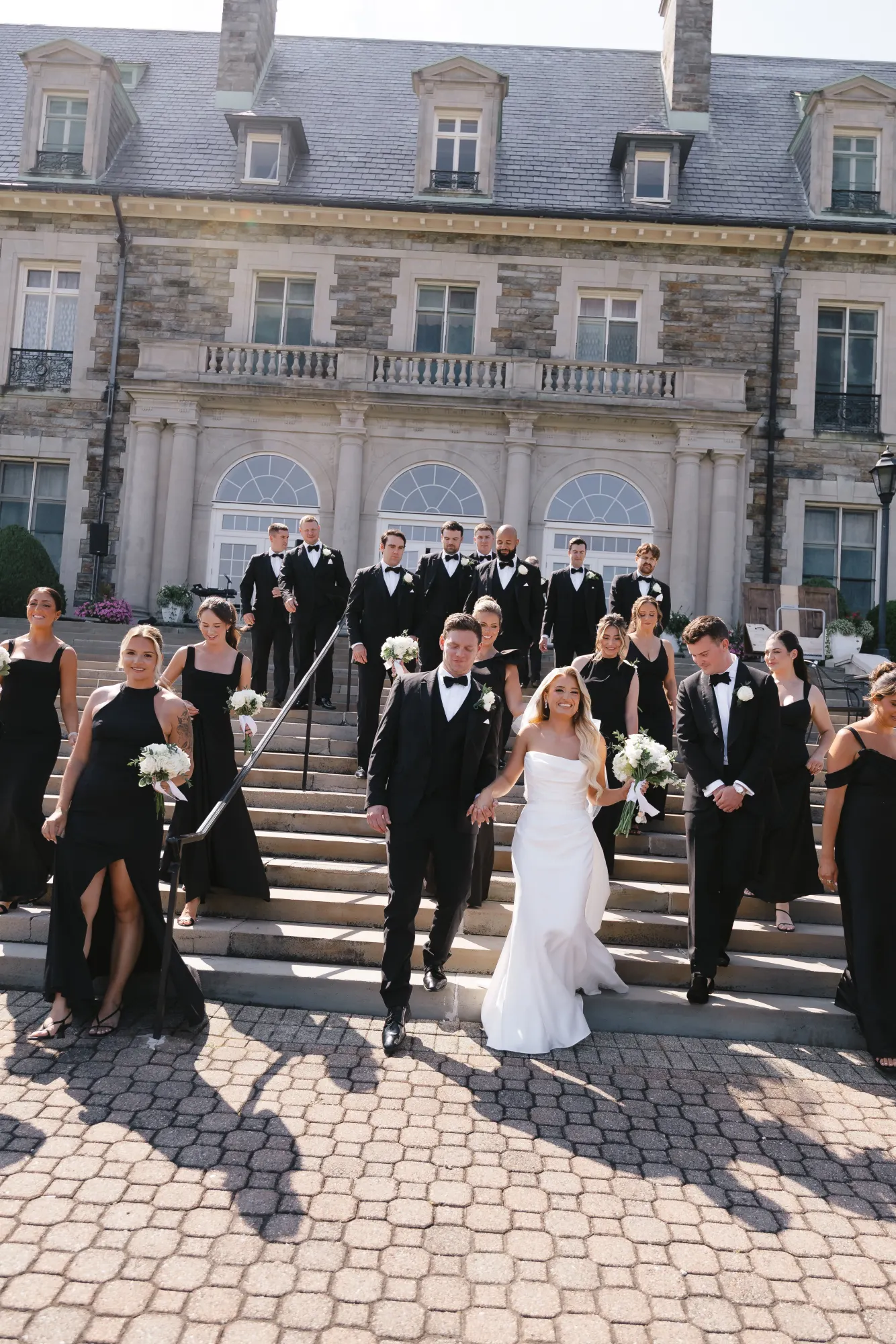 The wedding party walks the front drive of Aldrich Mansion