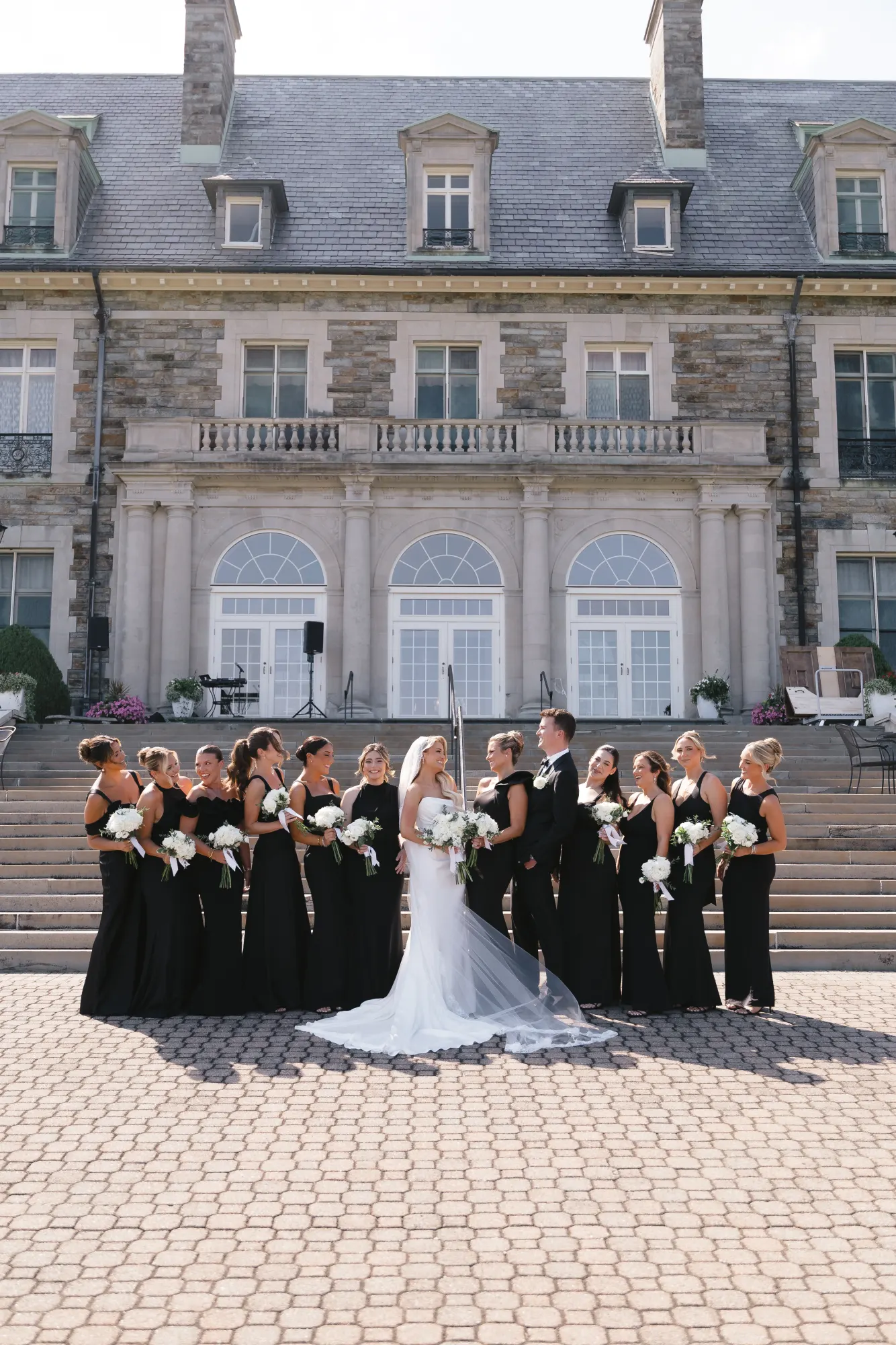 The bride and her bridesmaids in front of Aldrich Mansion