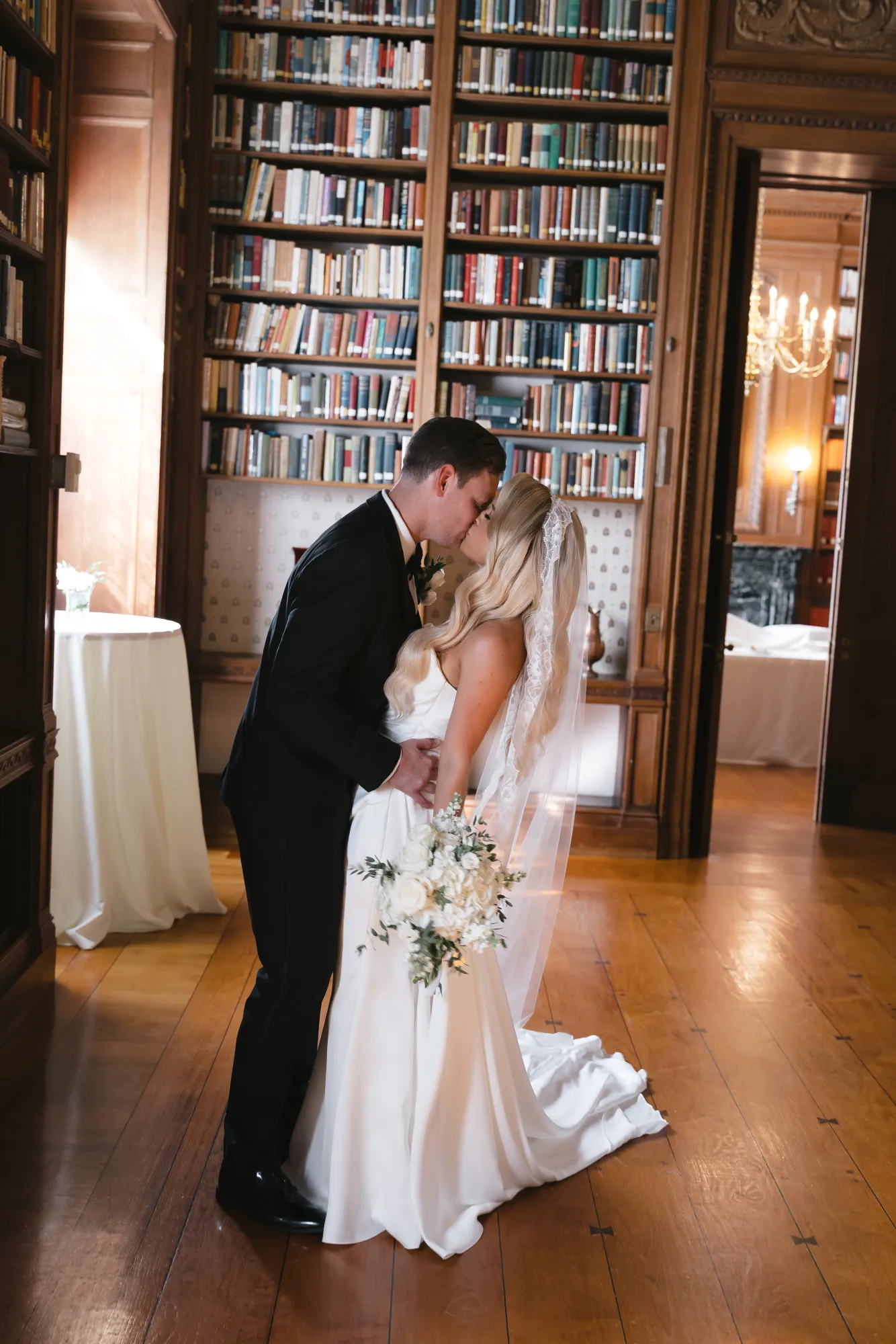 A stolen kiss in the Aldrich Mansion library