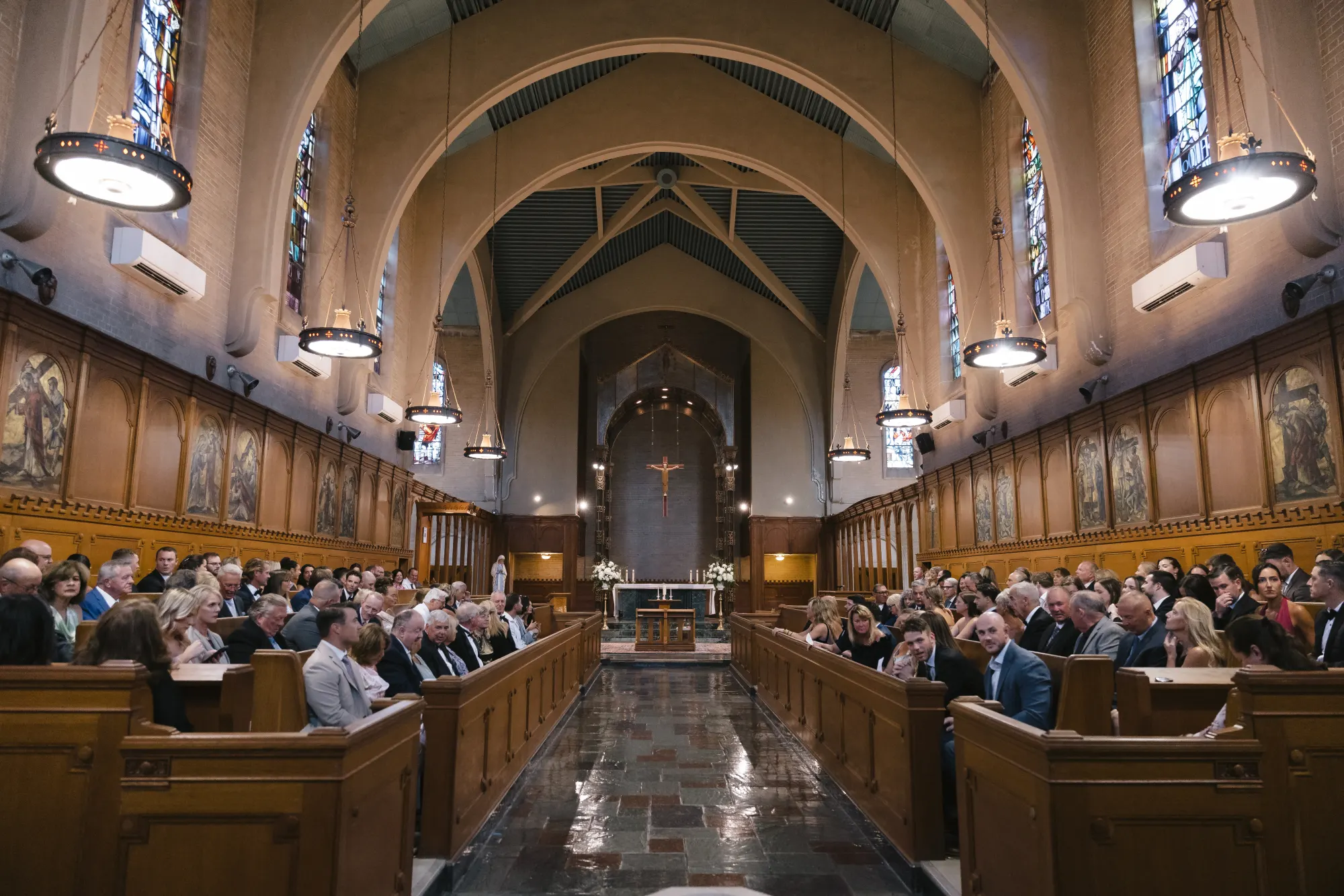 Guests fill the historic stone chapel on the Aldrich Mansion estate