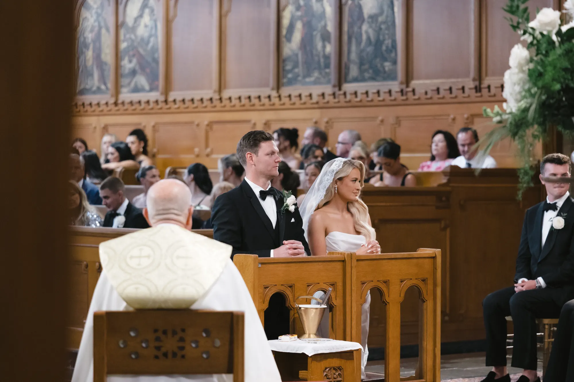 Father Bernard leads the wedding mass in the estate chapel