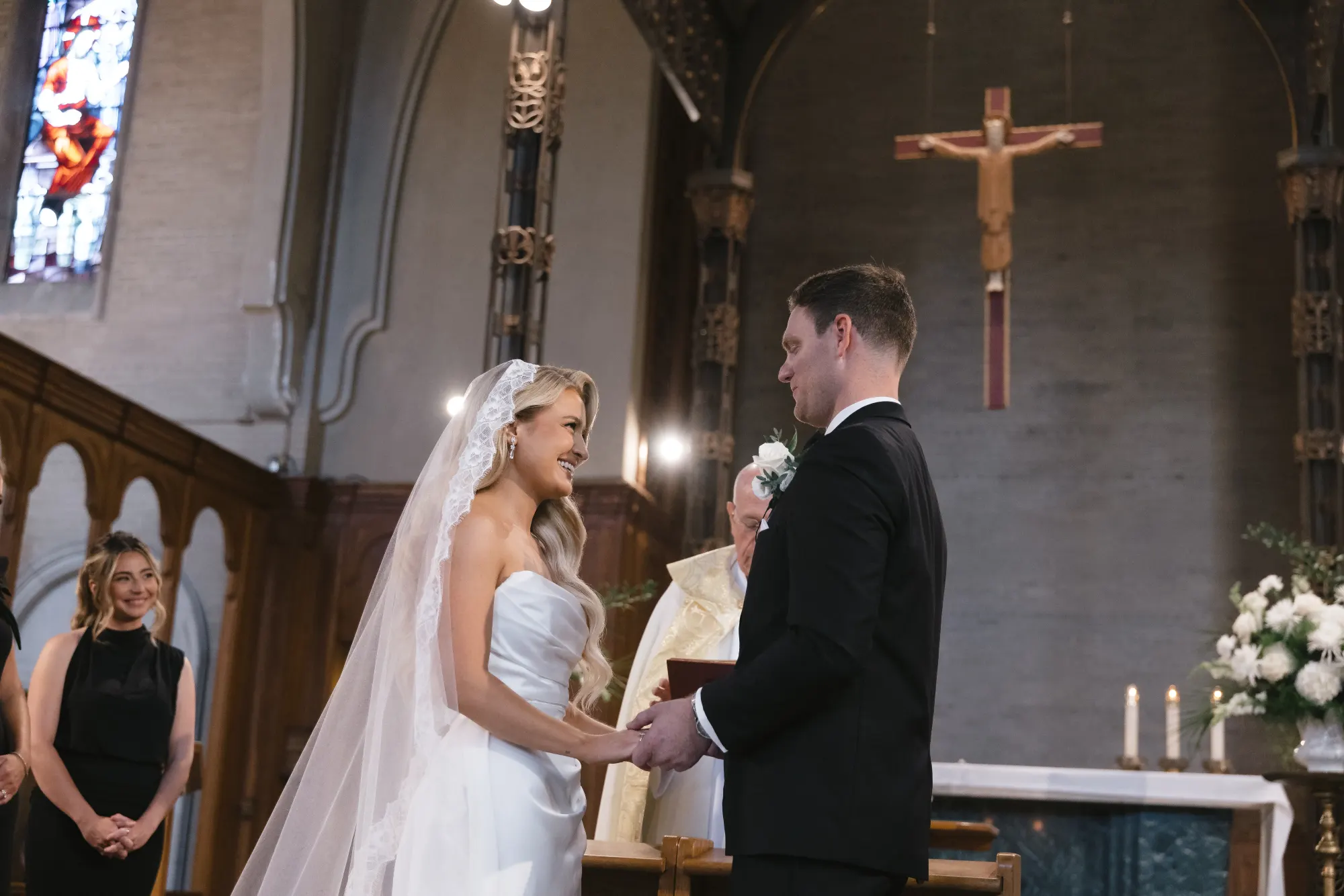 Vows before Father Bernard at the chapel altar