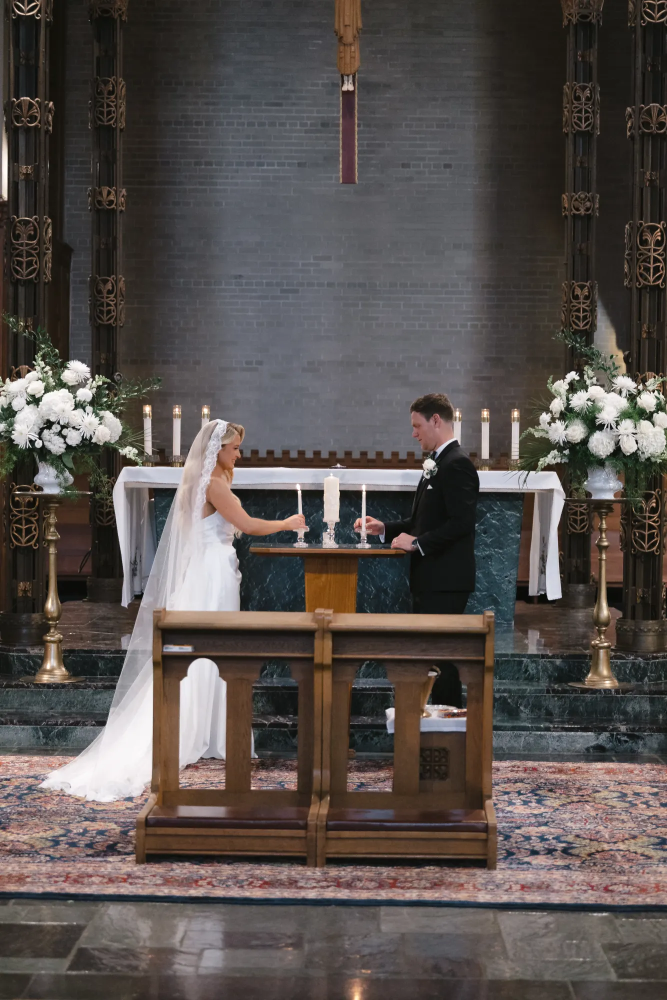 Colleen and Max light the unity candle