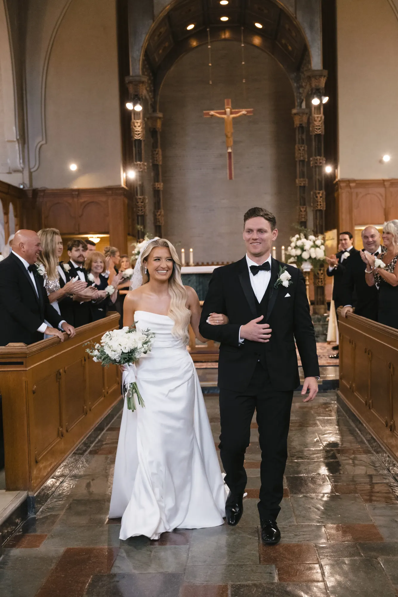 The recessional up the chapel aisle, all smiles