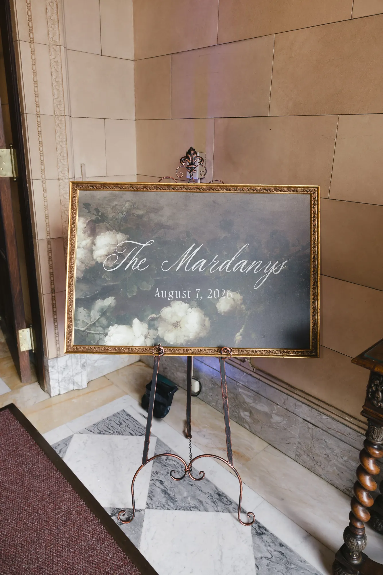 The Mardanys welcome sign in a gilt frame at the reception entrance