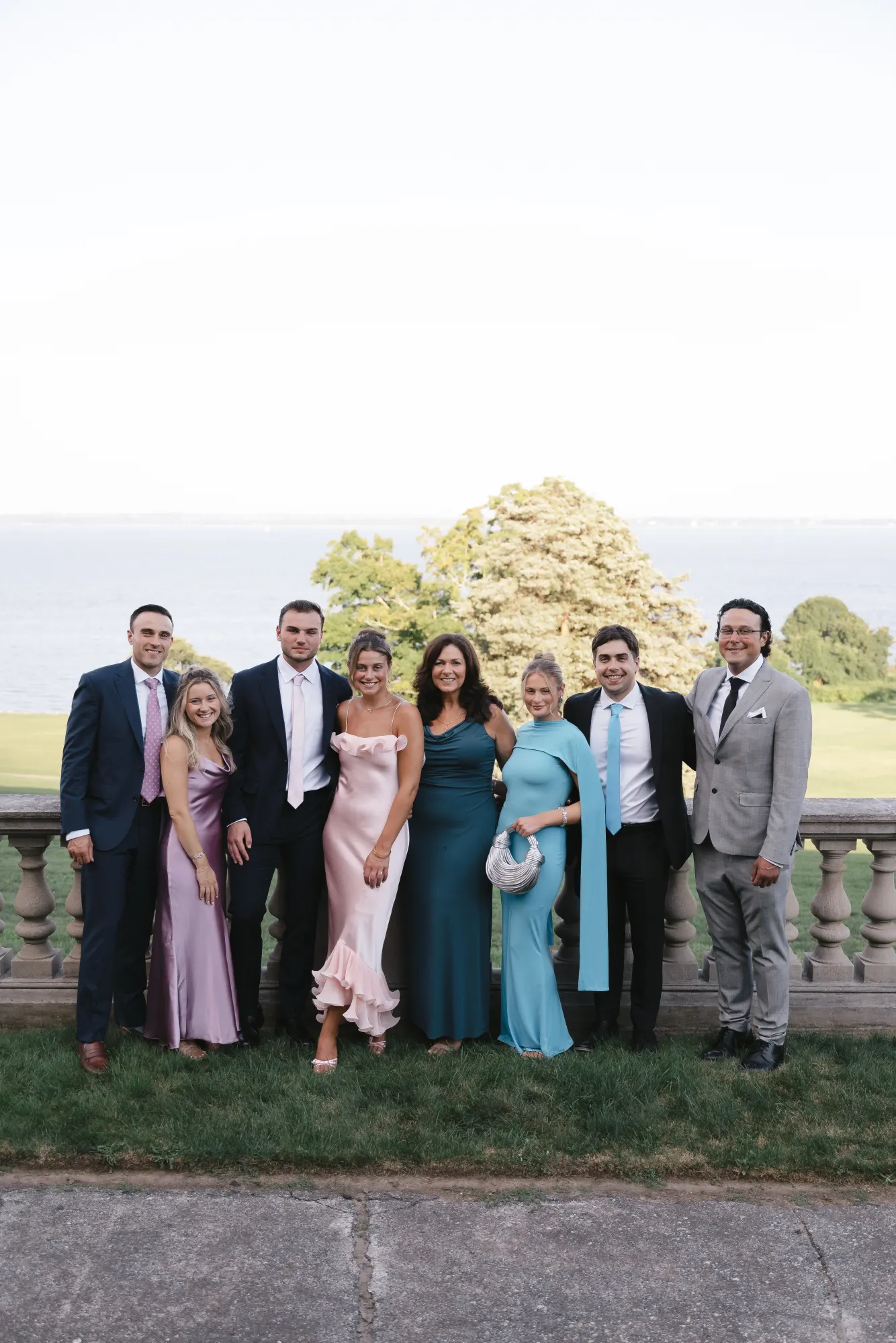 Guests gather on the lawn above Narragansett Bay during cocktail hour