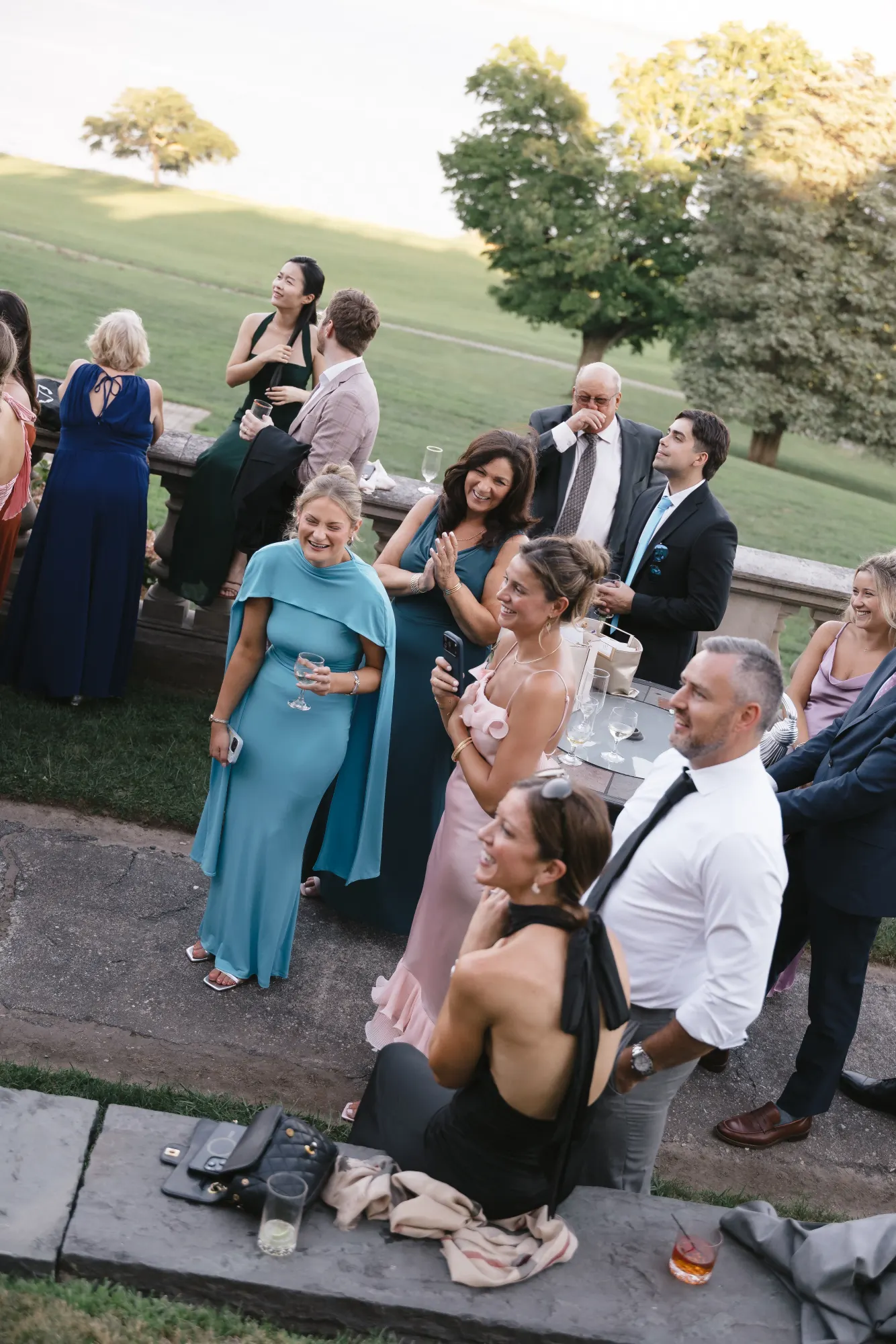Guests listen from the lawn during the toasts