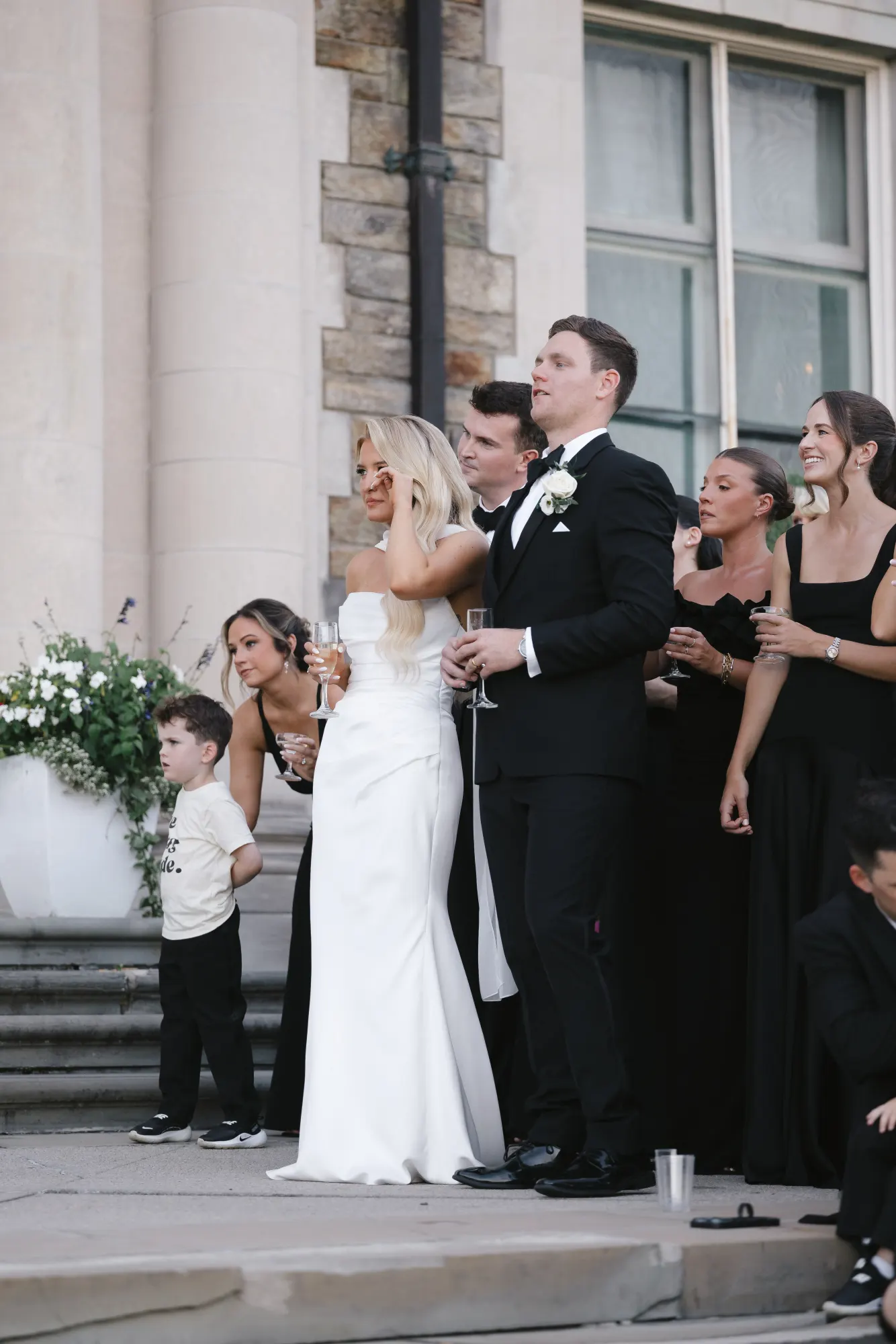 The ring bearers join the couple during the toasts