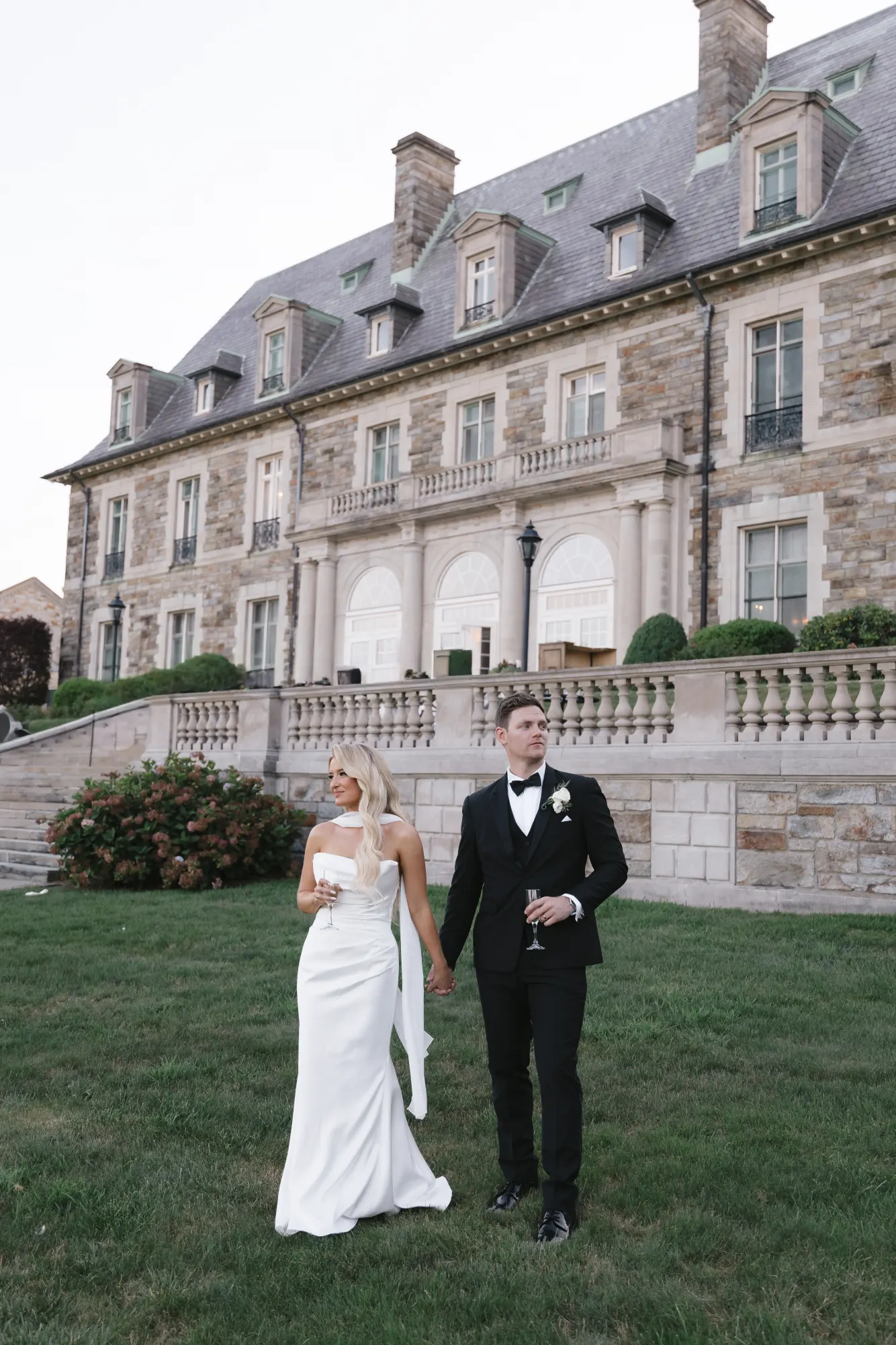 An evening stroll in front of the Aldrich Mansion facade
