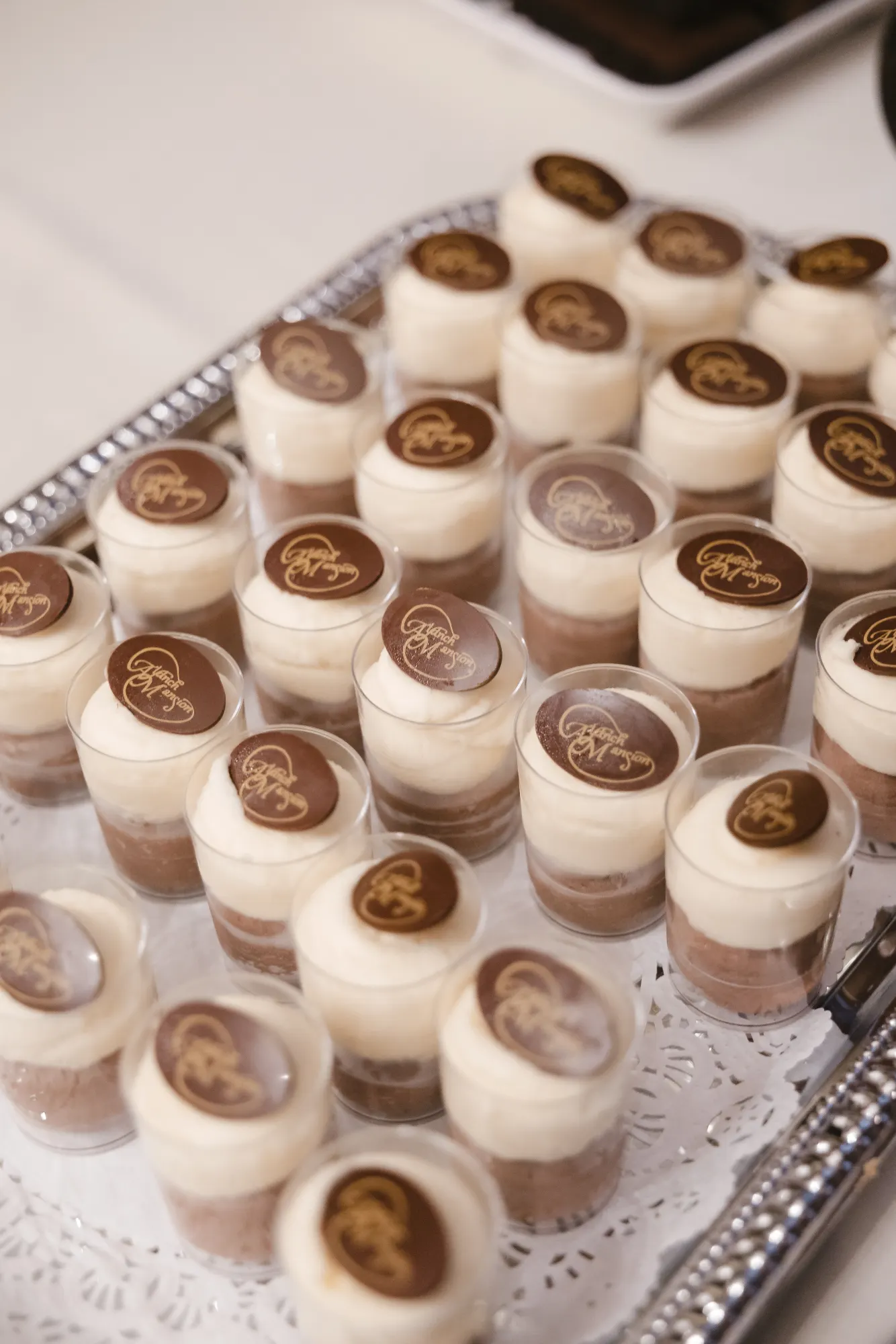 Mini dessert cups lined up in the dessert room