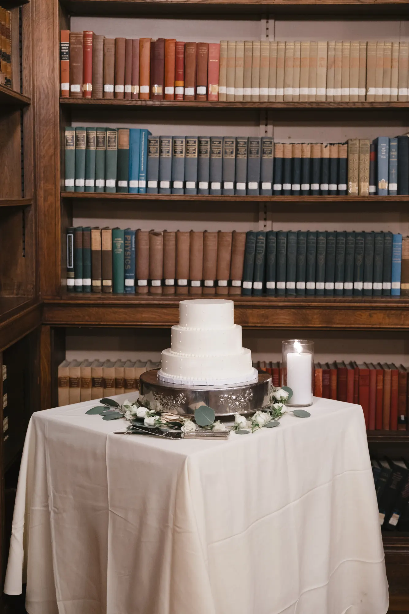 The wedding cake from Wright's Farm Bakery in the mansion library