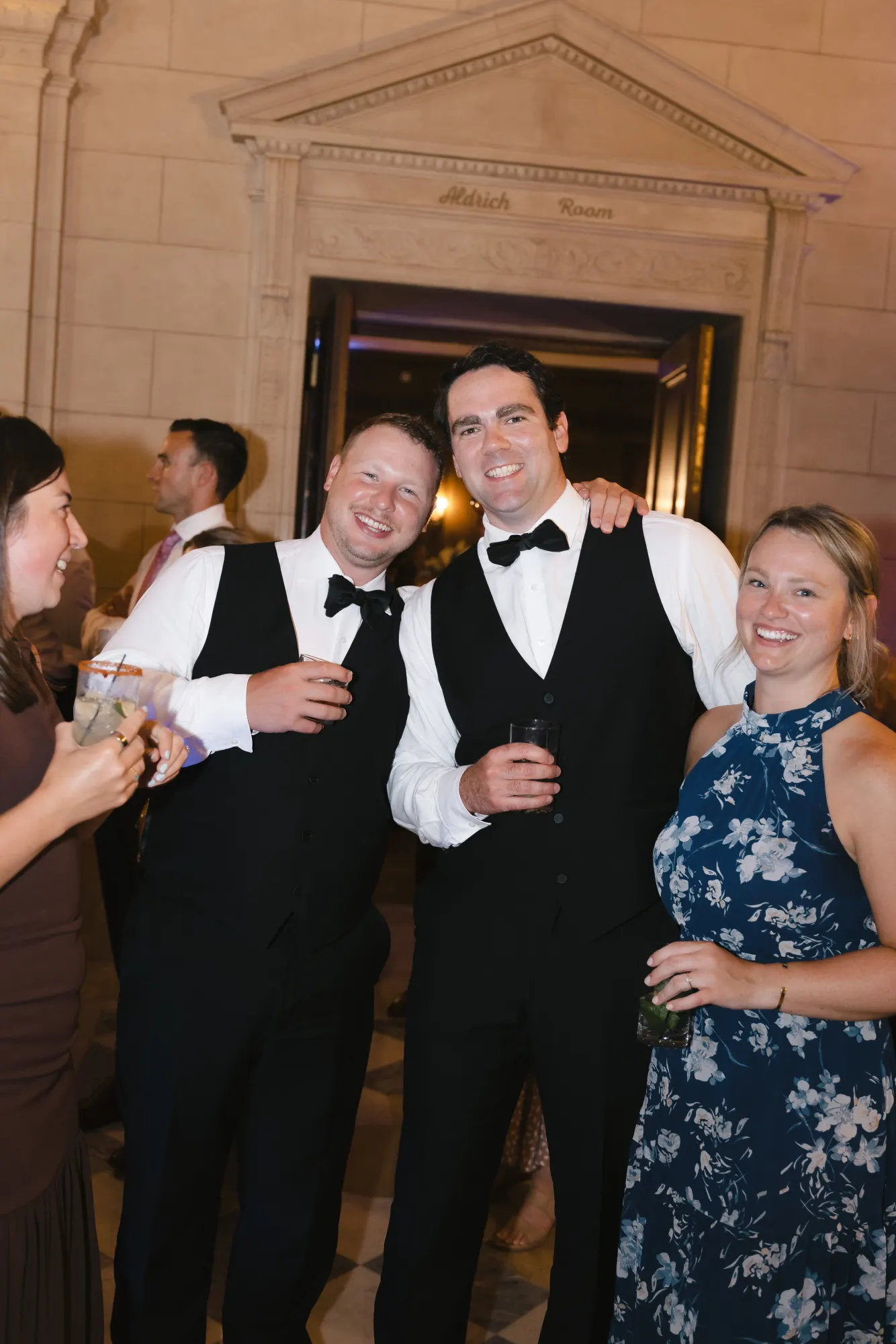 The groomsmen share a laugh at the reception