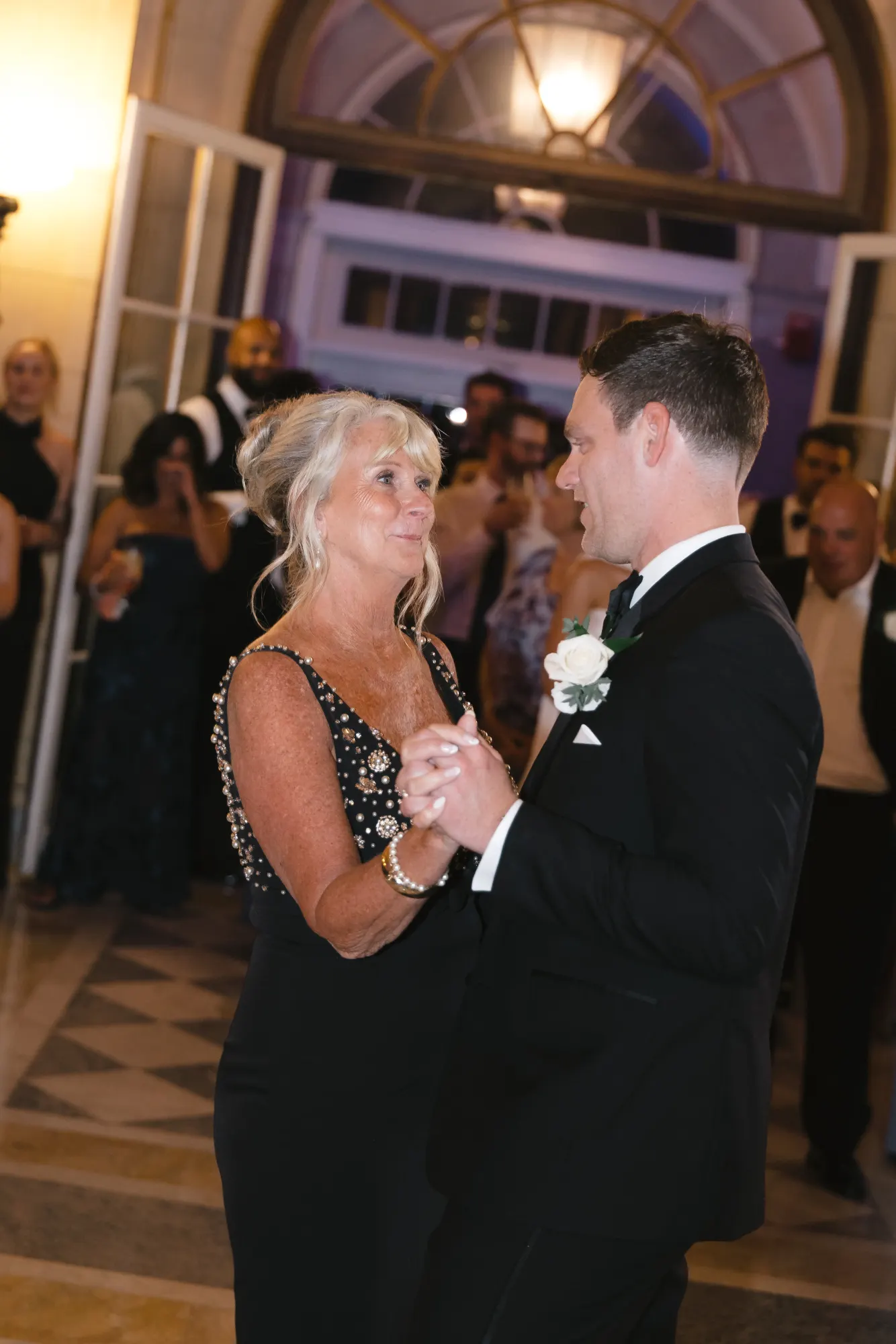 Max dances with his mother